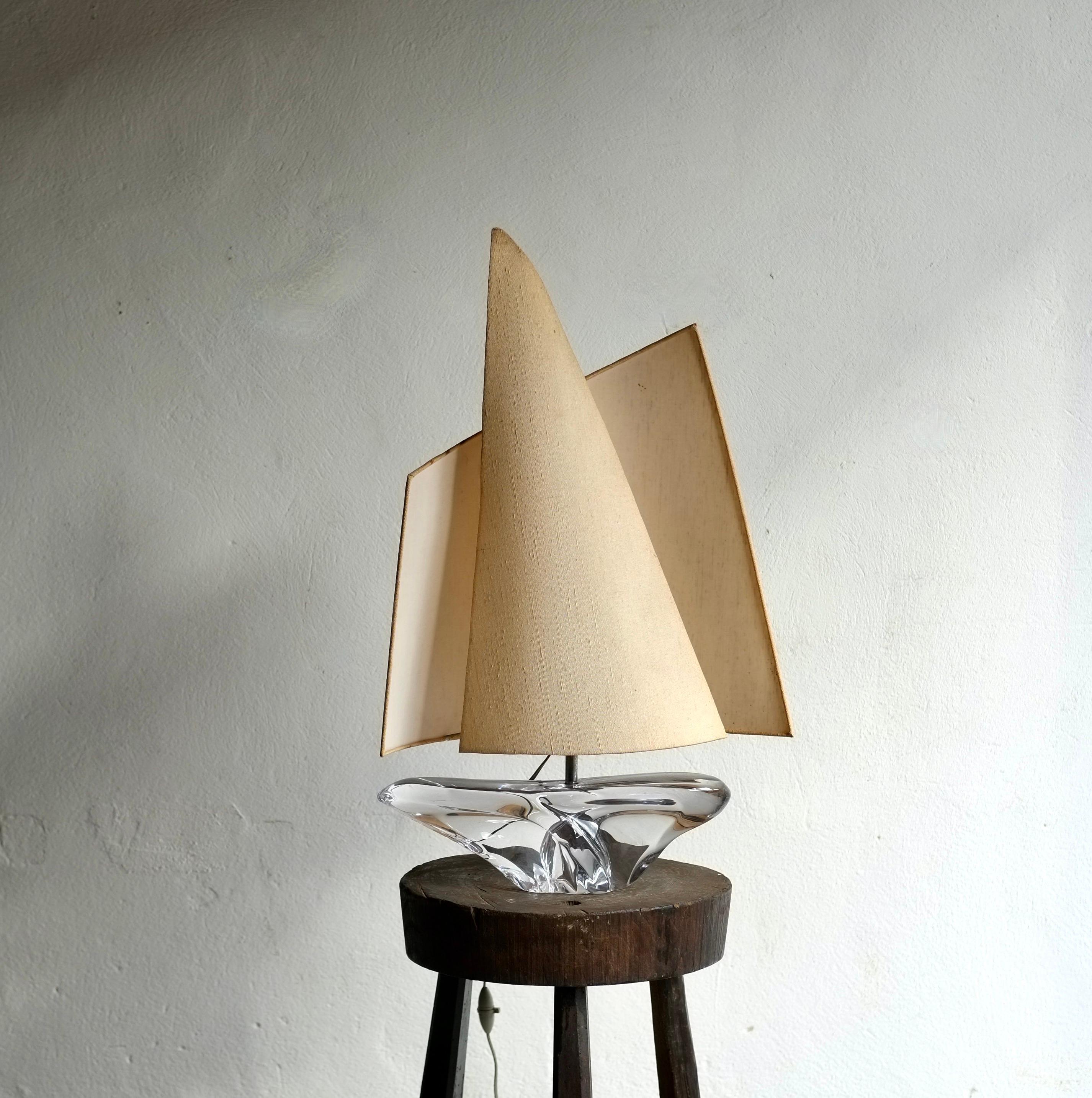 A large sailboat lamp manufactured by Daum, France in the 1960's.

Crystal glass base with a striking sculptural windsail style shade. In very good vintage condition with no damage.