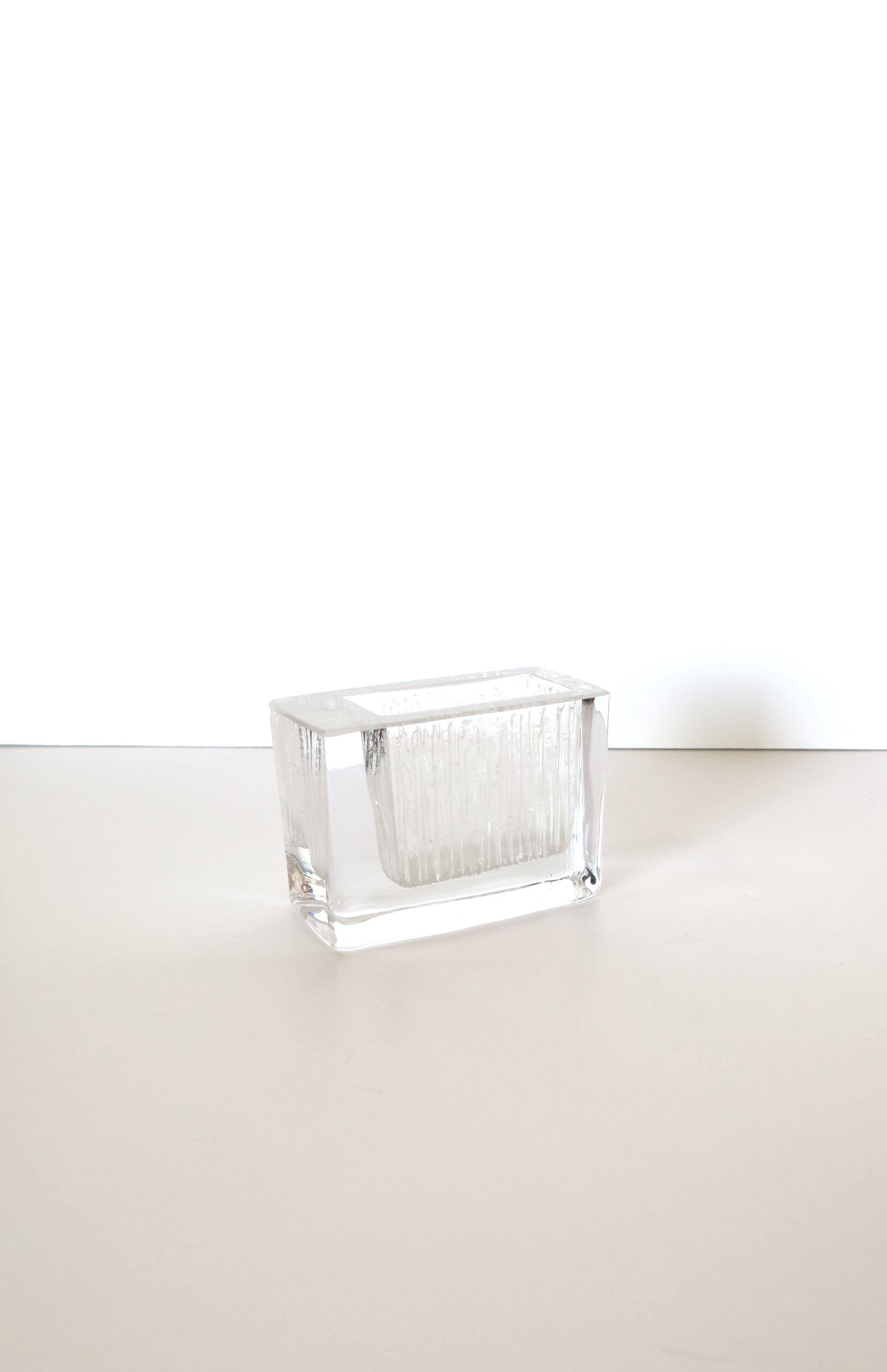 A beautiful, small, and substantial French crystal vase from luxury Maison, Daum, in the modern Minimalist styles, circa 20th century, France. The piece is rectangular in shape with an etched glass design. Beautiful as a standalone piece or with