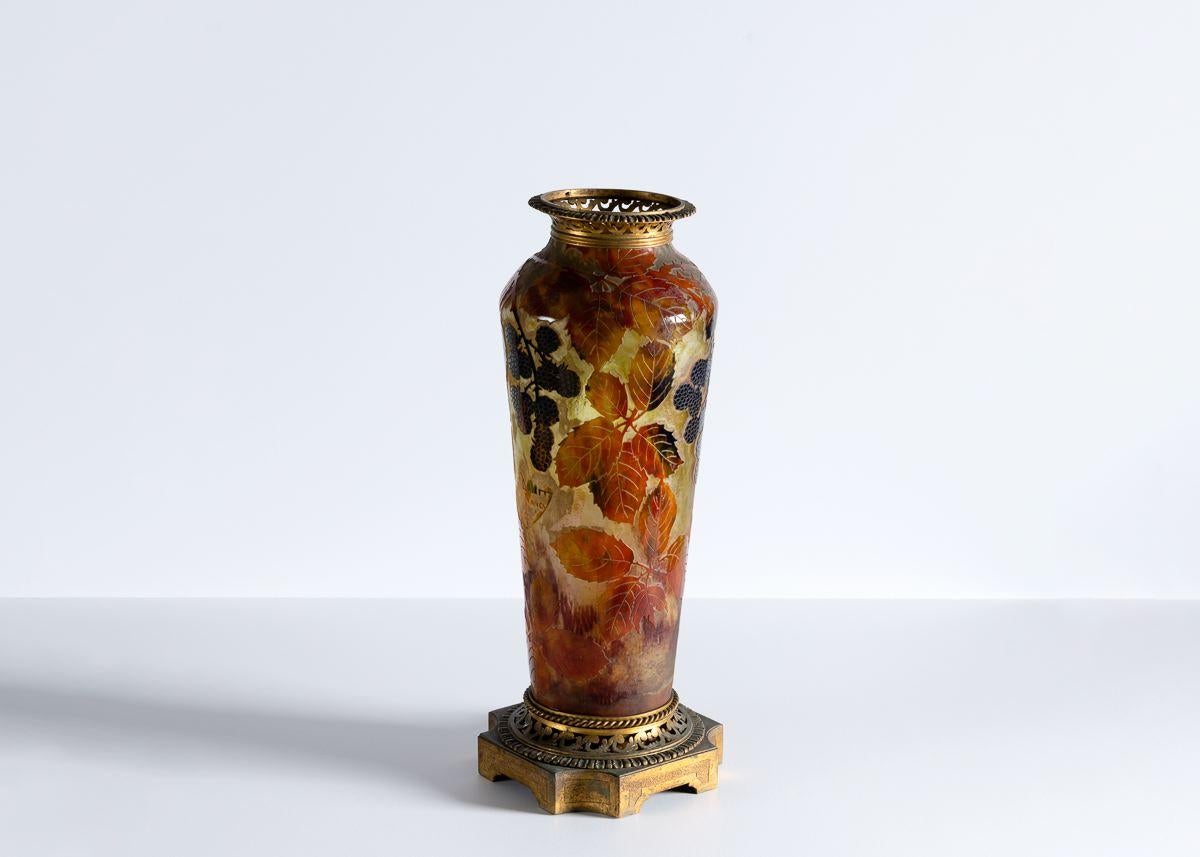 Etched: Daum Nancy with the Croix de Lorraine

This multi-layered acid etched vase is covered in images of a blackberry bush and features remarkably intricate detailing of gilt bronze at both the base and the lip.