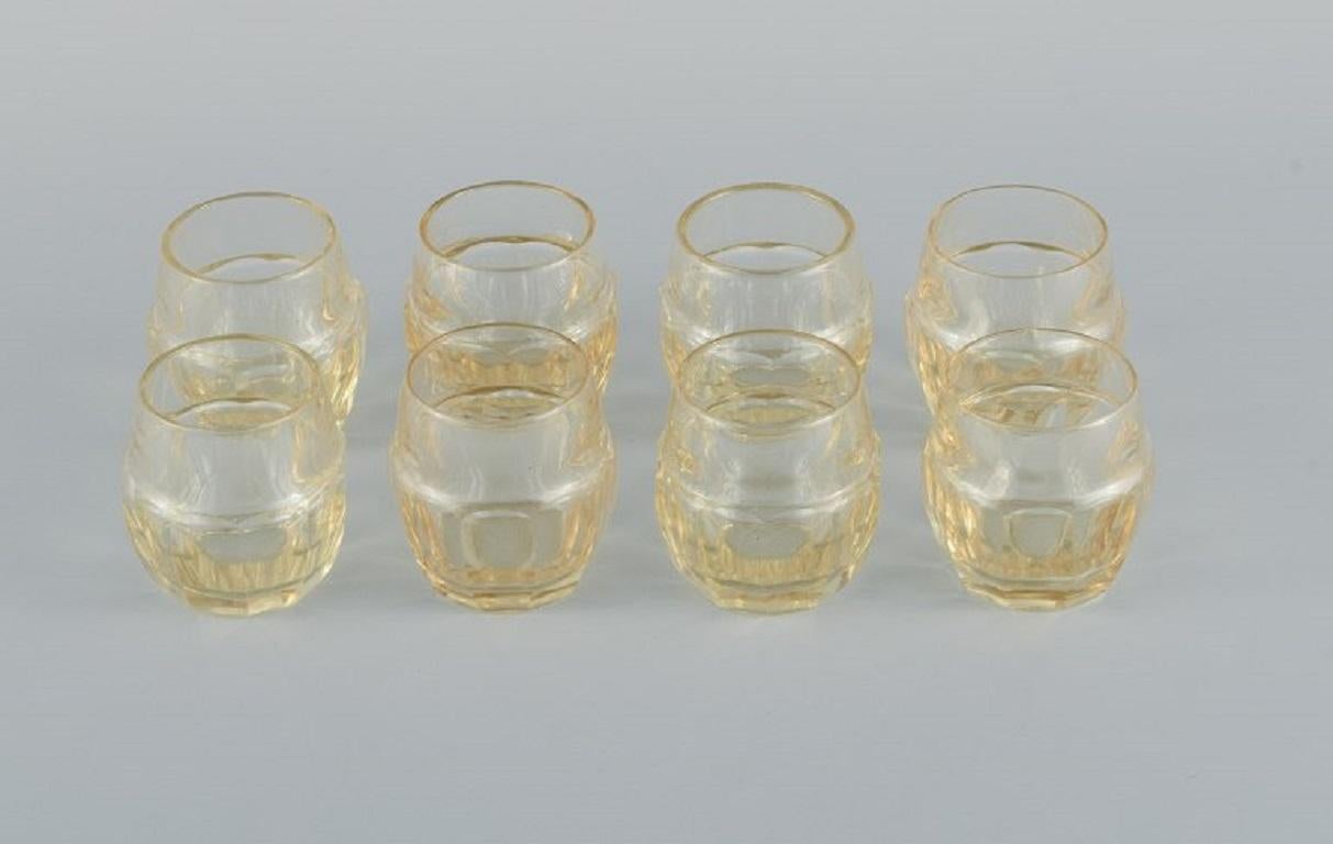 Daum, France, Art Deco decanter and set of eight liqueur glasses in faceted smoke-colored art glass.
1930/40s.
Inscribed DAUM, NANCY, FRANCE.
In great condition.
Glass: H 5.5 cm. x D 4.5 cm.
Carafe: H 23 cm. x D 12.0 cm.