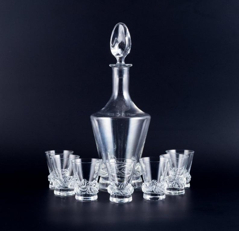 Daum, France, crystal liqueur set, consisting of a carafe and seven liqueur glasses.
Model: Sorcy.
Mid-20th century.
Signed Daum, France.
In perfect condition.
Carafe: H 32.0 cm x D 13.0 cm.
Glasses: H 7.3 cm.