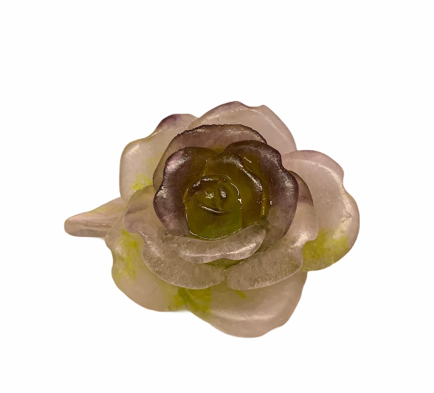 This a charming pate de verre frosted crystal rose paperweight painted in wine and green color in its petals. Under the rose is signed Daum, France. The gift of a rose, always expresses Love.