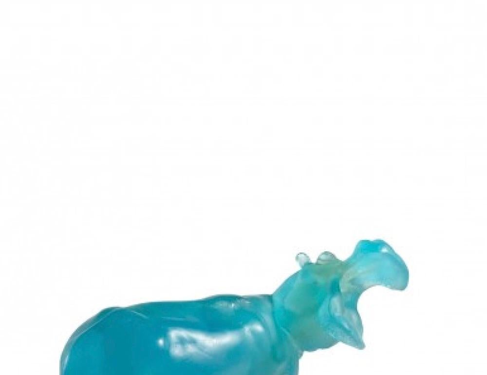 Hippopotamus Daum France
SAFARI ANIMALS Collection
Molded glass paste pressed and tinted turquoise blue, resting on a rectangular base of amber tinted glass.
Signed 