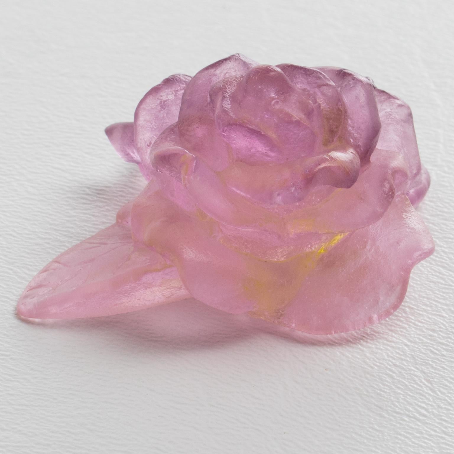 This charming pate de verre frosted crystal rose paperweight or decorative sculpture is by Daum, France, and was hand-made in the 1970s. The sculpture features a delicate rose flower in powder pink color with purple and green-yellow overtones. The