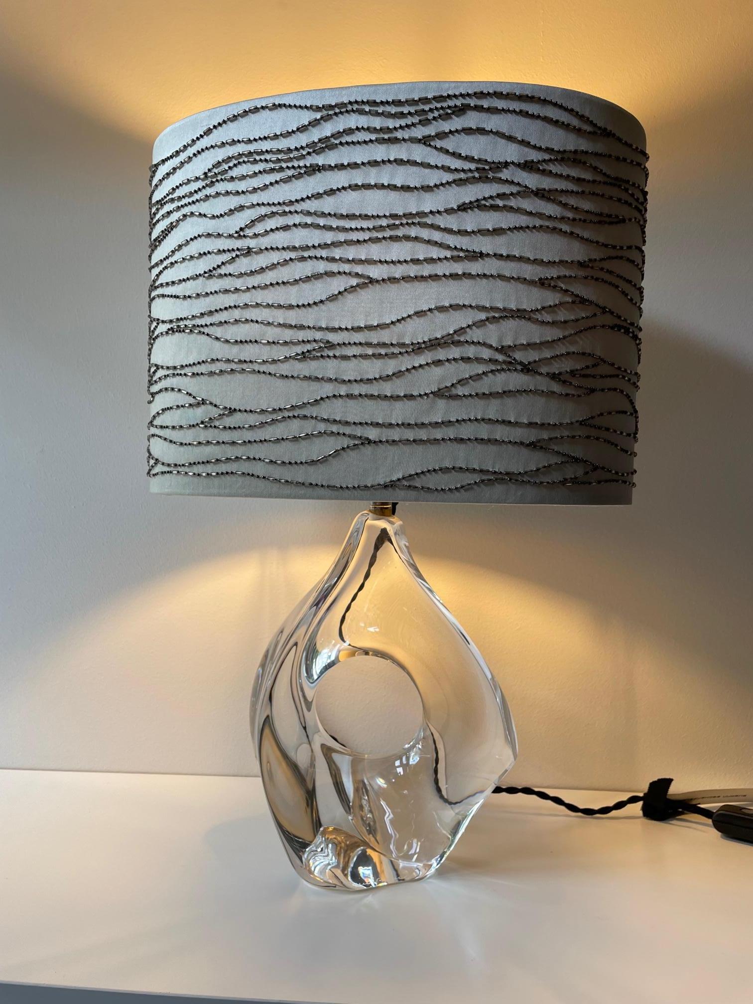 Beautiful amorphous table Light, clear crystal, free hand-formed by Michel Daum, France, produced 1958, signed on the Bottom Daum France, new textile wiring (textile cable color black) with UK plug, size of crystal base 22cm H x 19cm W x 9cm D,