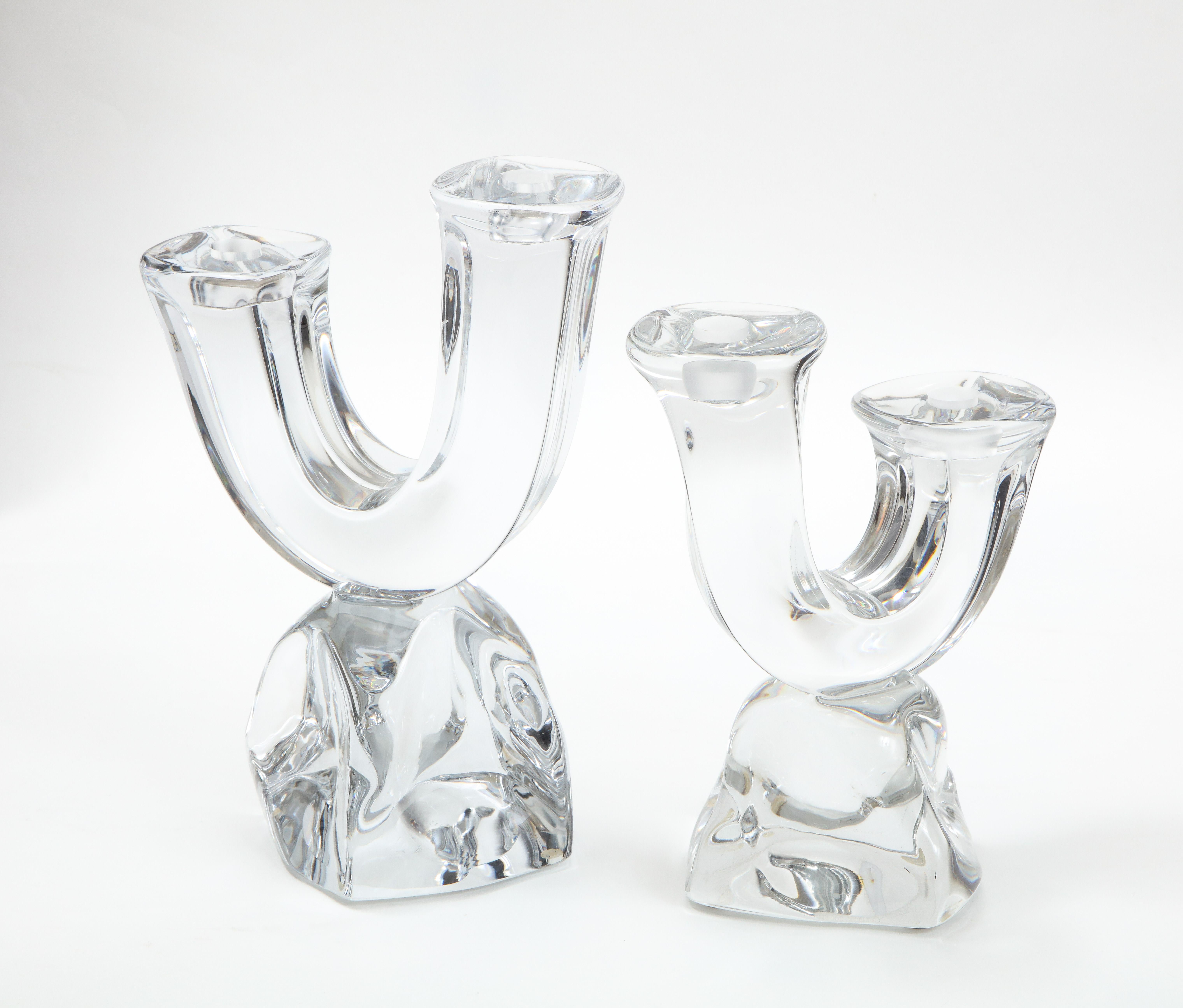 Stunning pair of 1960s modern handmade two-arm crystal candle holders by Daum France. Both are signed. 

Please notice the size is slightly different.

Smaller candleholder measurements: width 8'' depth 4'' height 9.5''.