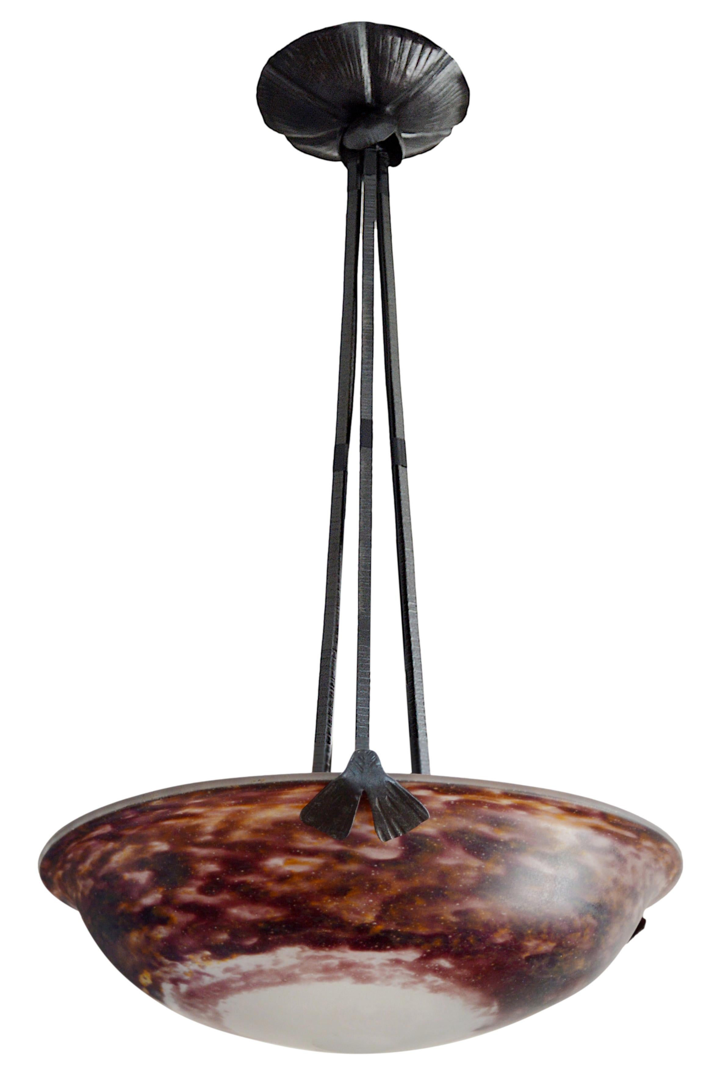 French pendant chandelier by DAUM (Nancy), France, dating from 1900-1905. This exquisite piece features a blown double glass shade, suspended from its original wrought-iron frame. The shade is beautifully crafted with rich hues of purple, ochre, and