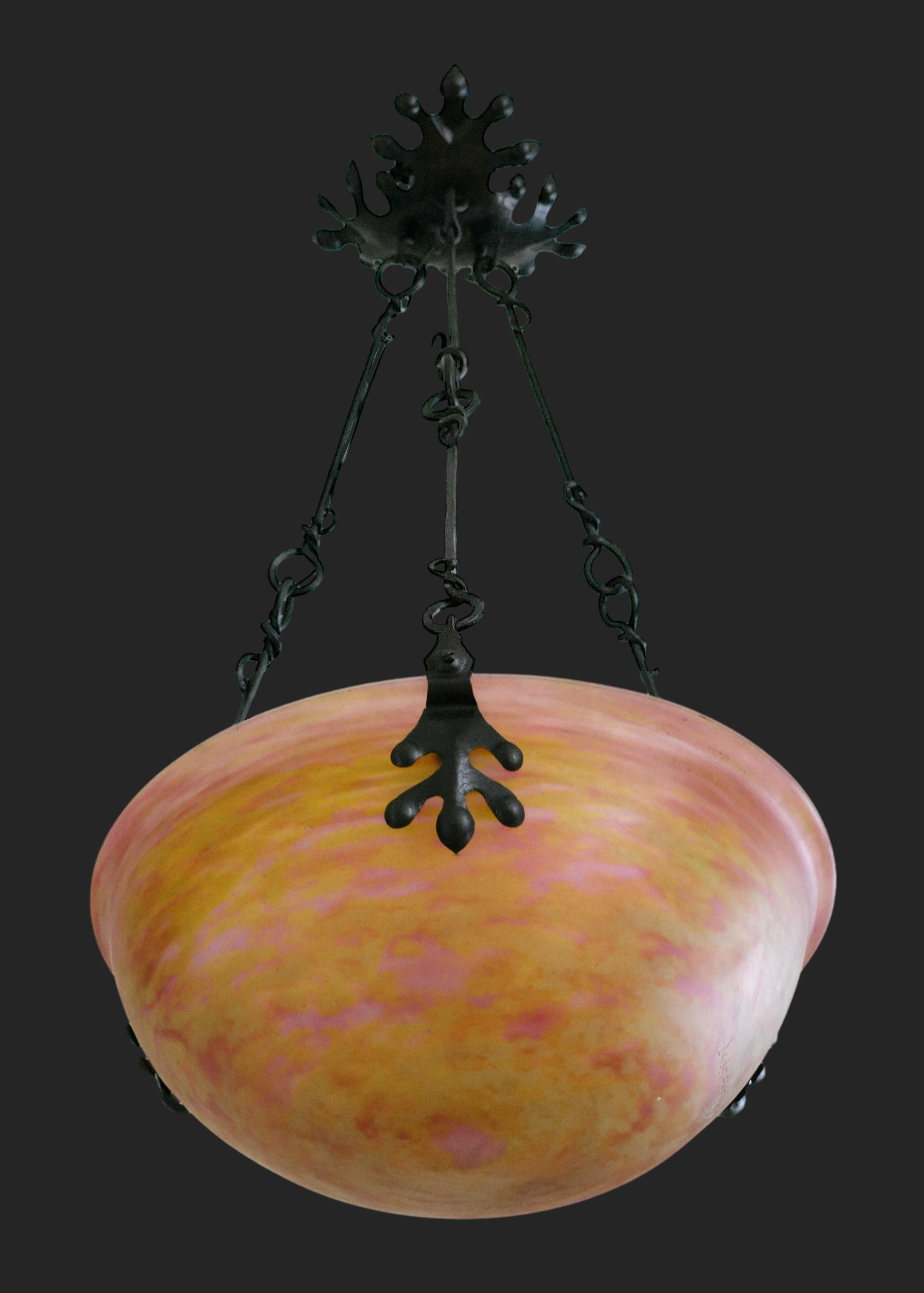 French Art Nouveau - Art Deco pendant chandelier by DAUM (Nancy), France, 1910-1915. New Style - Transitional period between Art Nouveau and Art Deco. Blown double glass shade hung at its wrought-iron frame. Colors : pink and yellow. Height :