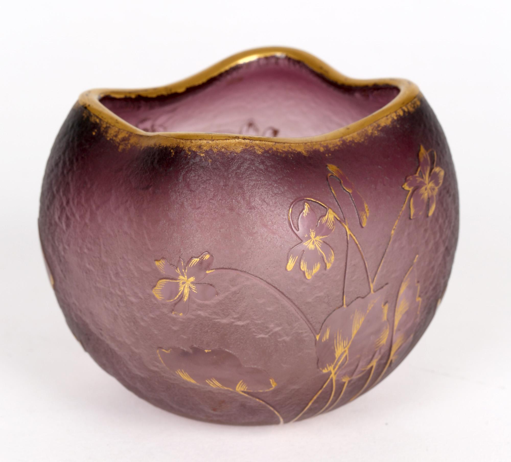 An exceptional French Art Nouveau Daum Frères cameo glass vase wheel cut with raised floral designs dating from around 1900. The vase is of square rounded shape and made in a pale amethyst color with a textured opaque matted body and with the raised