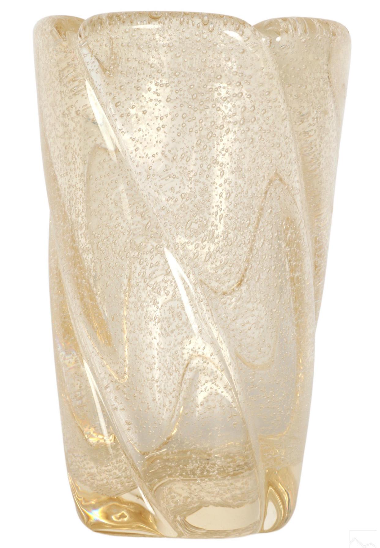 A fine Daum French crystal vase. Gold ribbed body with swirling design and interior controlled, captured, bubbles. Signed DAUM NANCY FRANCE at bottom rim. 
Dimensions: 10 X 6 X 6 in. 

Daum’s vases of the Art Deco period, unlike their earlier glass,