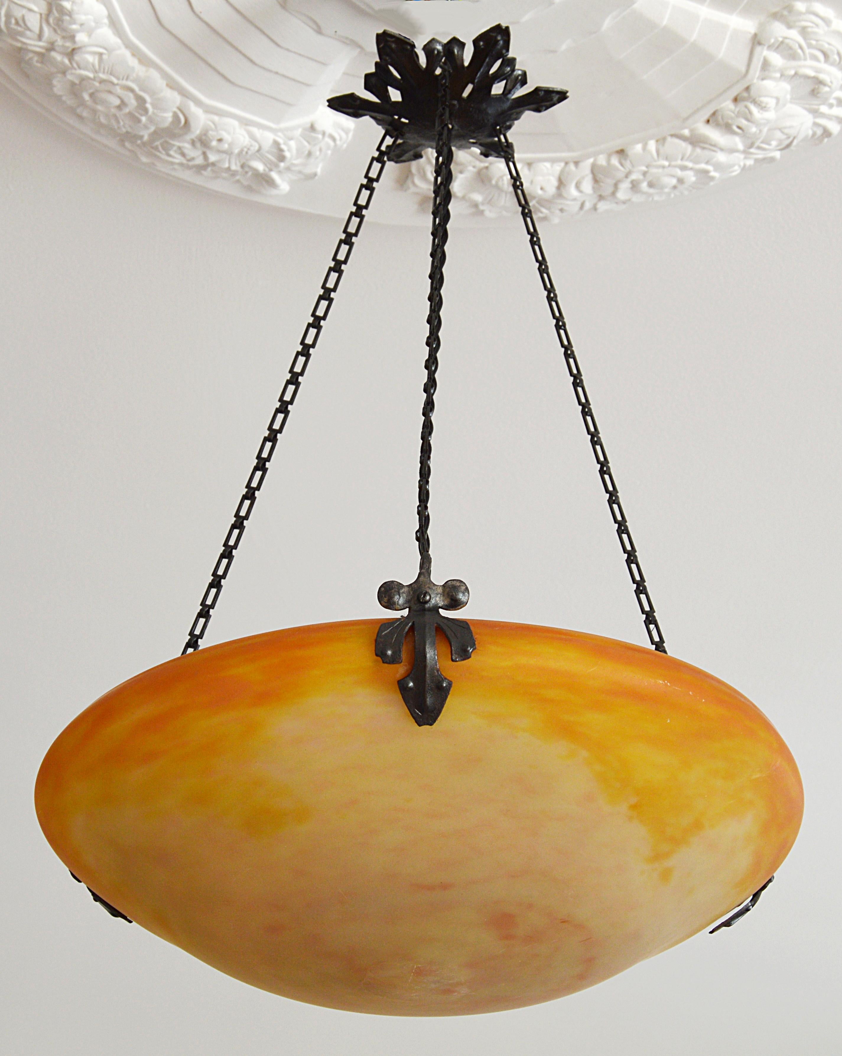 Any fair offer will be examined with the utmost attention, please send a message. French pendant chandelier by Daum (Nancy), France, 1900-1905. Blown double glass shade hung at its original wrought iron frame. Colors: pink, yellow, orange and white.