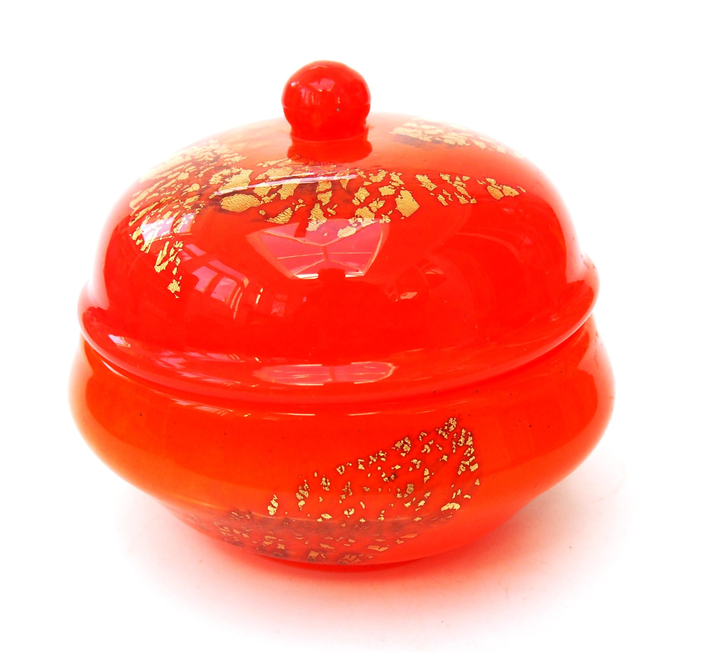 Striking Daum vibrant orange with gold foil inclusions 'Jades' box and cover with round knop to the lid. Daum's Jade series was first created just before c1914 -it consisted of recycled coloured glass, sandwiched between two layers of clear glass