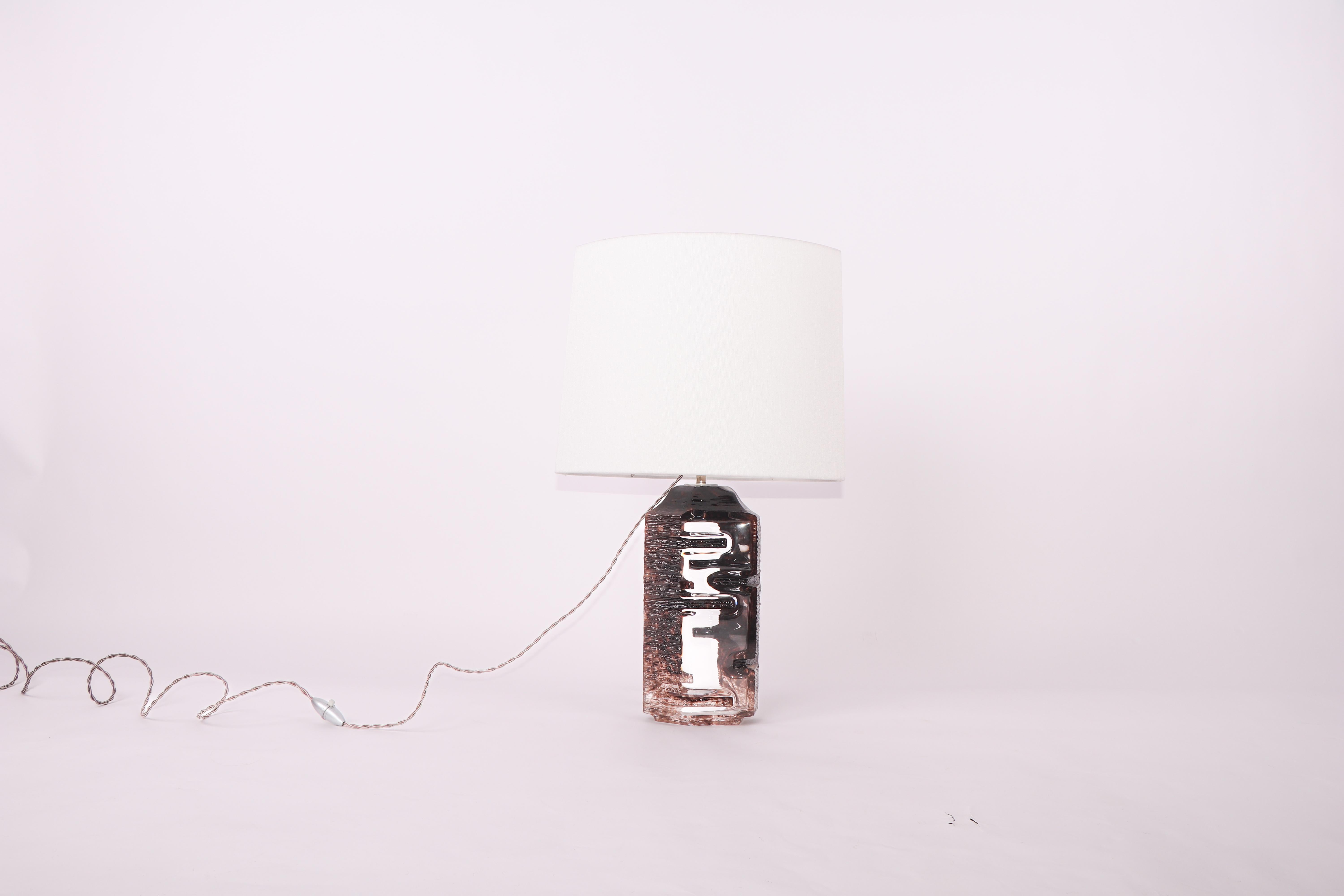 Wonderful Daum table lamp in an aubergine coloured crystal. This piece comes with a sur-mesure lampshade that complements its unique form. 

Signed 'Daum'. 

Accompanied by a certificate of authenticity from the Galerie Laurent Dubois. 
