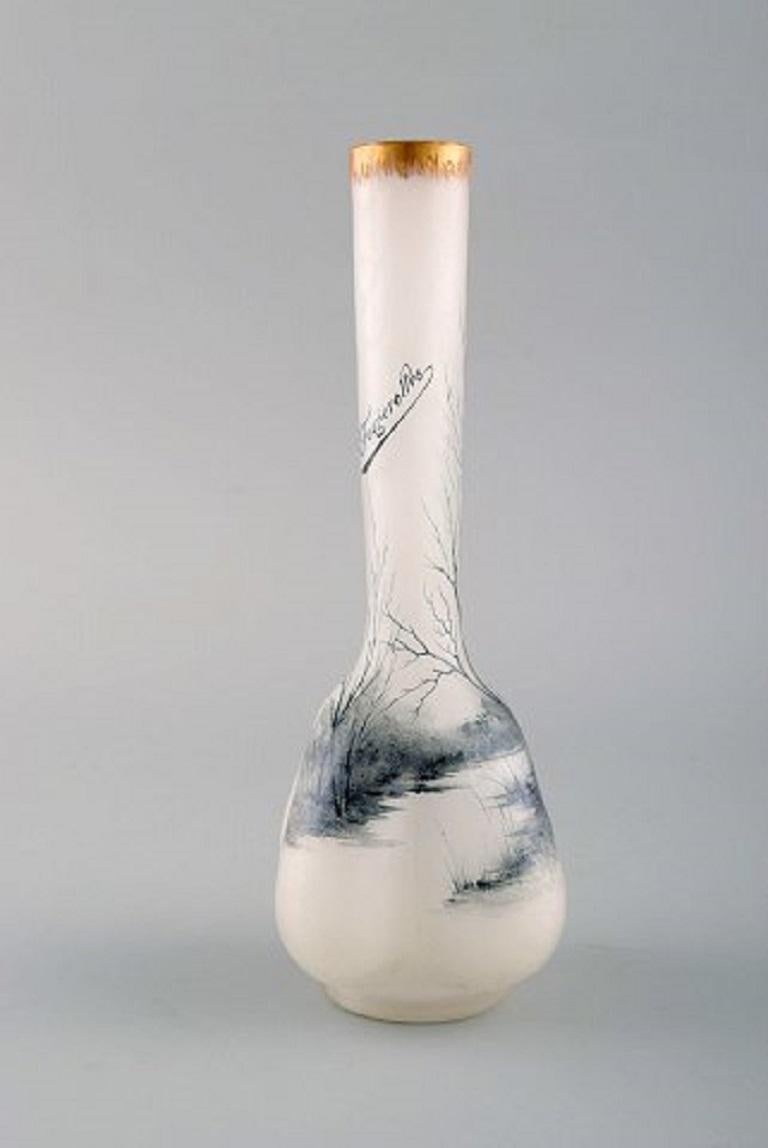 Daum, Nancy. A beautiful glass vase with a deep landscape of a town in winter inscribed 