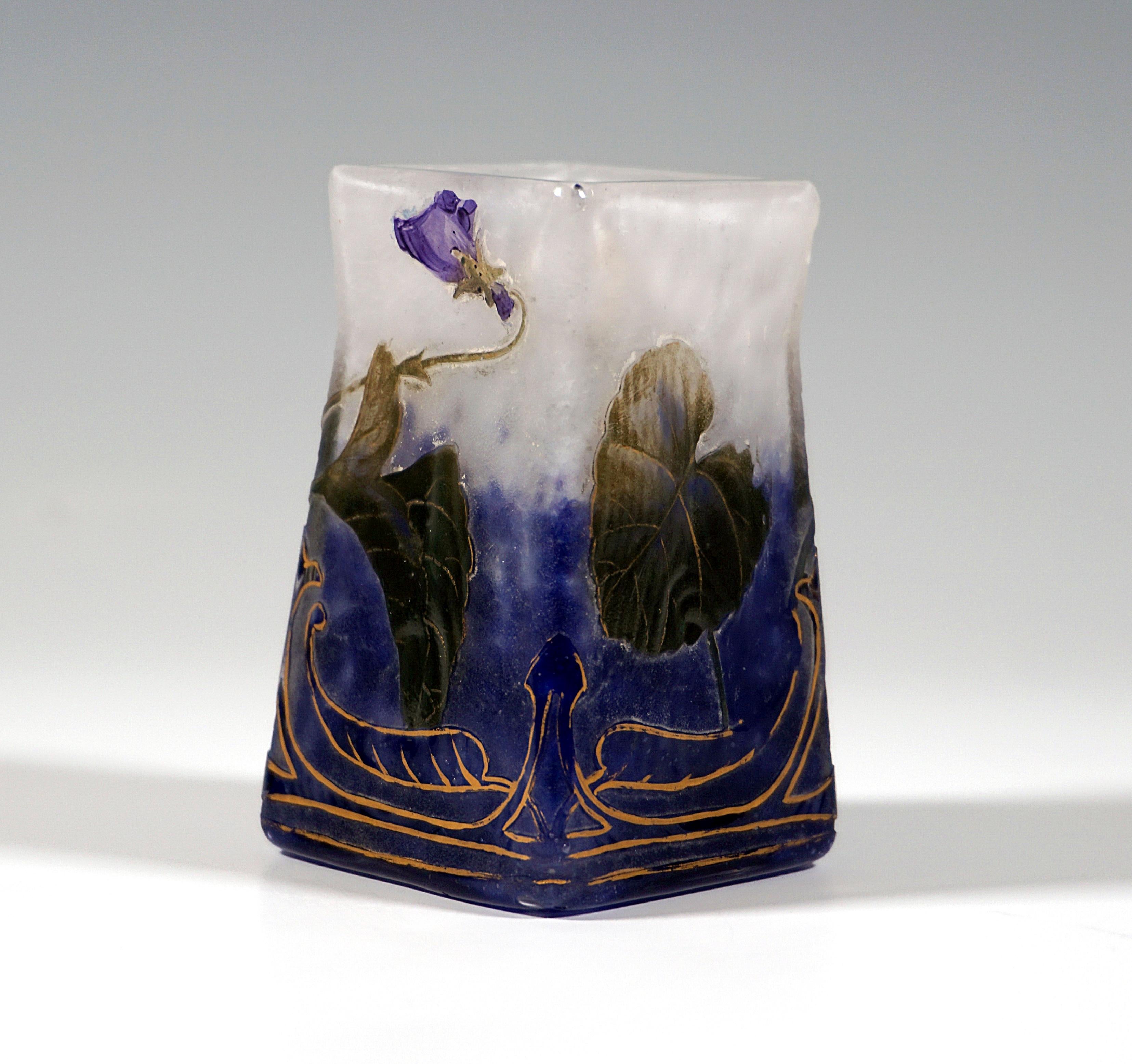 Exquisite French Art Nouveau glass craftsmanship:
Square vase on rhombic plan, colorless glass with flaky white, in stand area with cobalt blue powder fusions, etched and in colored enamel painted violet decor with gold hightening and gold