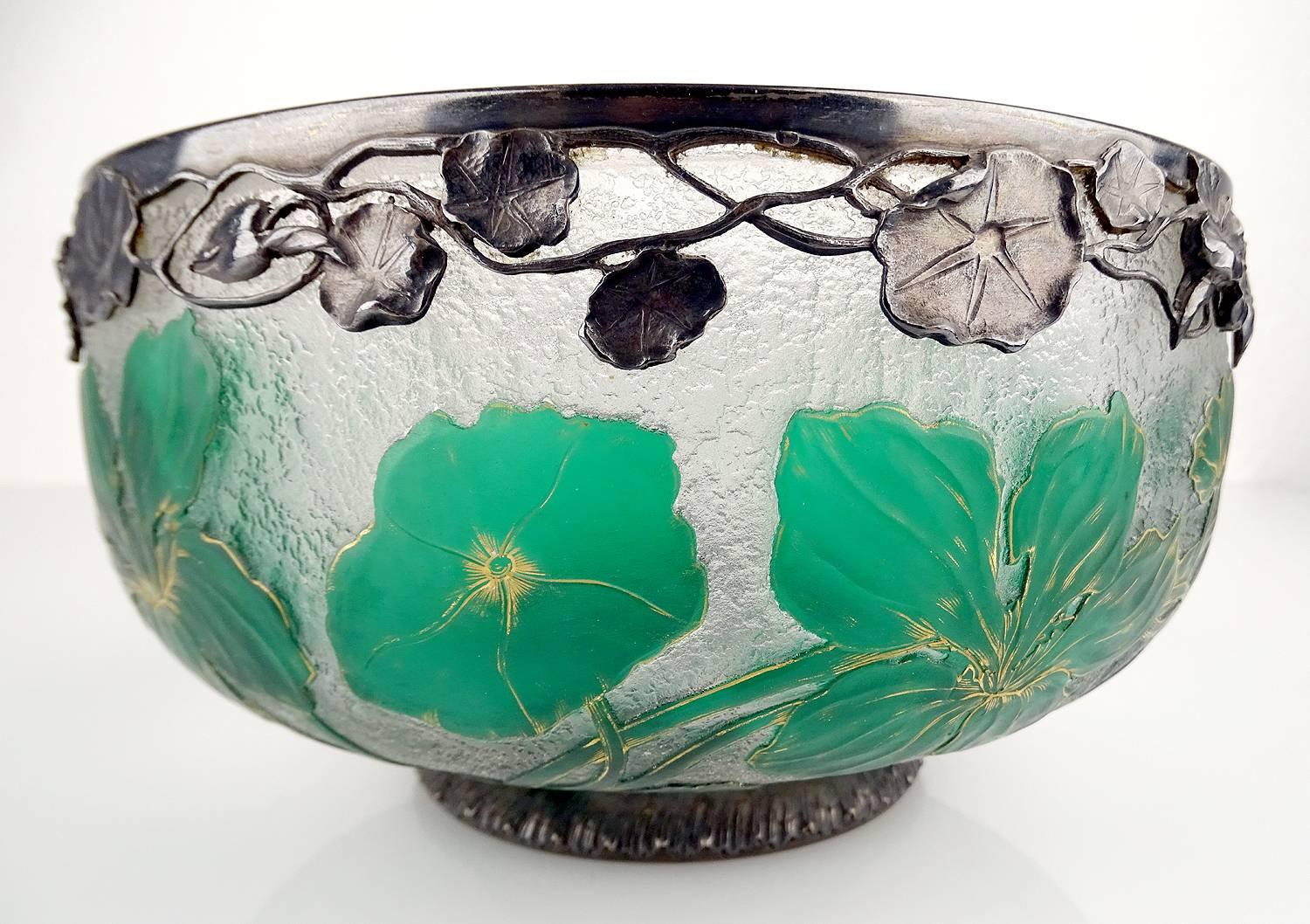 Exceptional French  Art Deco Daum bowl with squash blossom and sterling silver overlay,
overlay glass (green and clear), acid stenciled and wheel cut flowers, accentuated with gold,
wrought silver friese with identical flower patterns, signed with