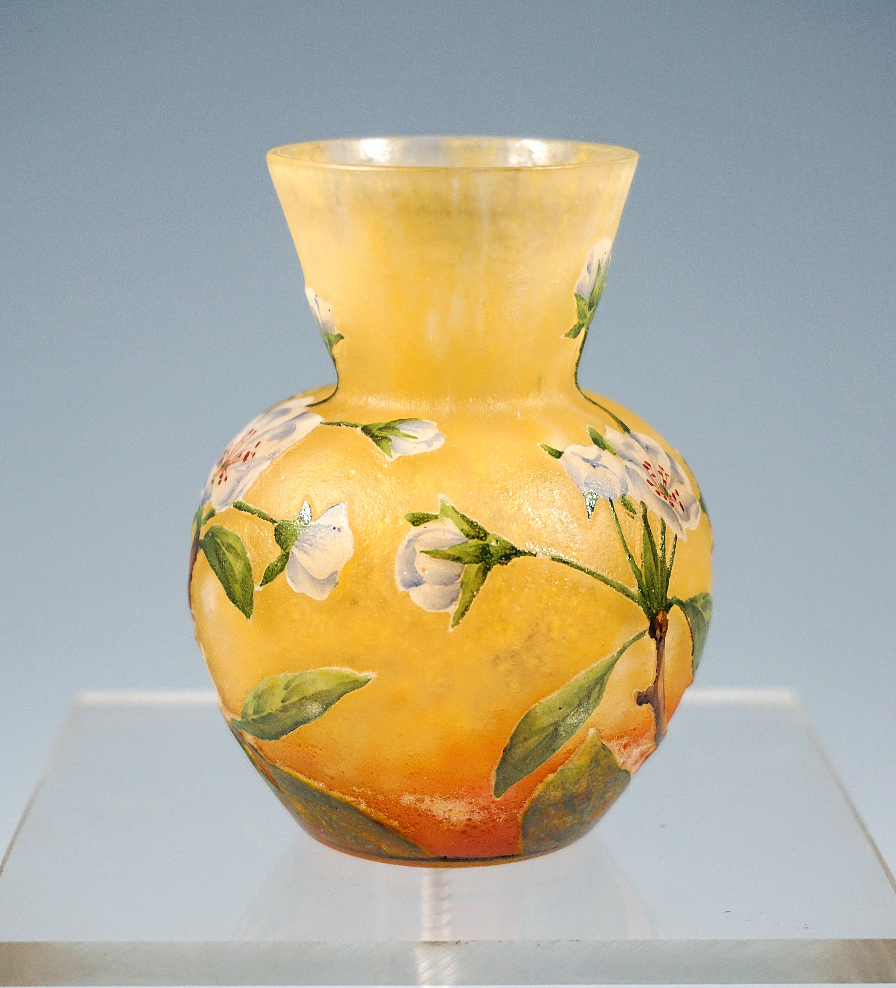 Small baluster vase, flush round stand, bulbous body with attached funnel-shaped neck, colorless glass with flaky color powder enamels in white and yellow, in lower part in red, overlay in white, with 
highly etched and painted with colored enamel