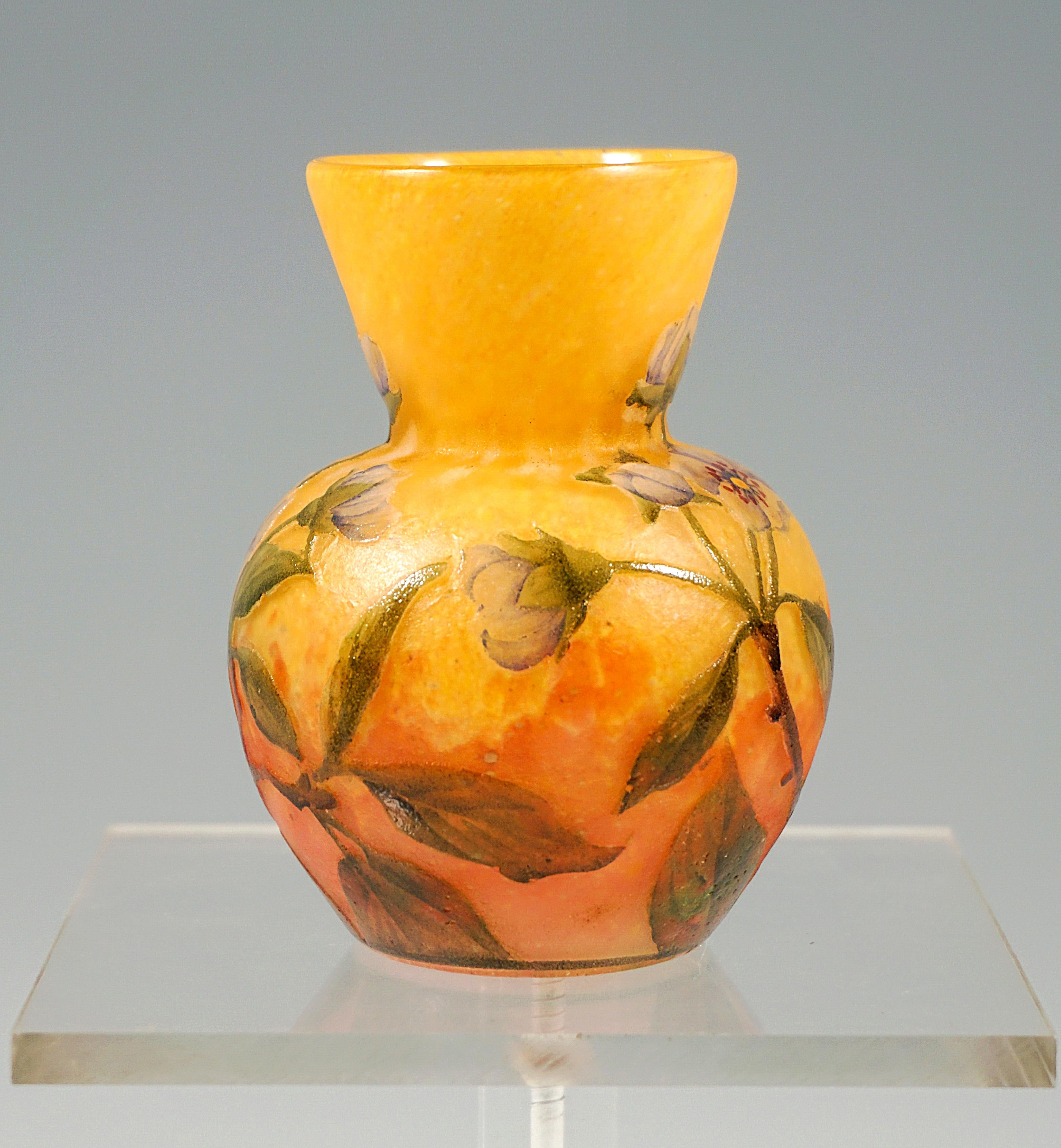 Small baluster vase, flush round stand, bulbous body with attached funnel-shaped neck, colorless glass with color powder enamels in yellow-orange and red, with highly etched and painted with color enamel strawberry plant decor, satin surface,