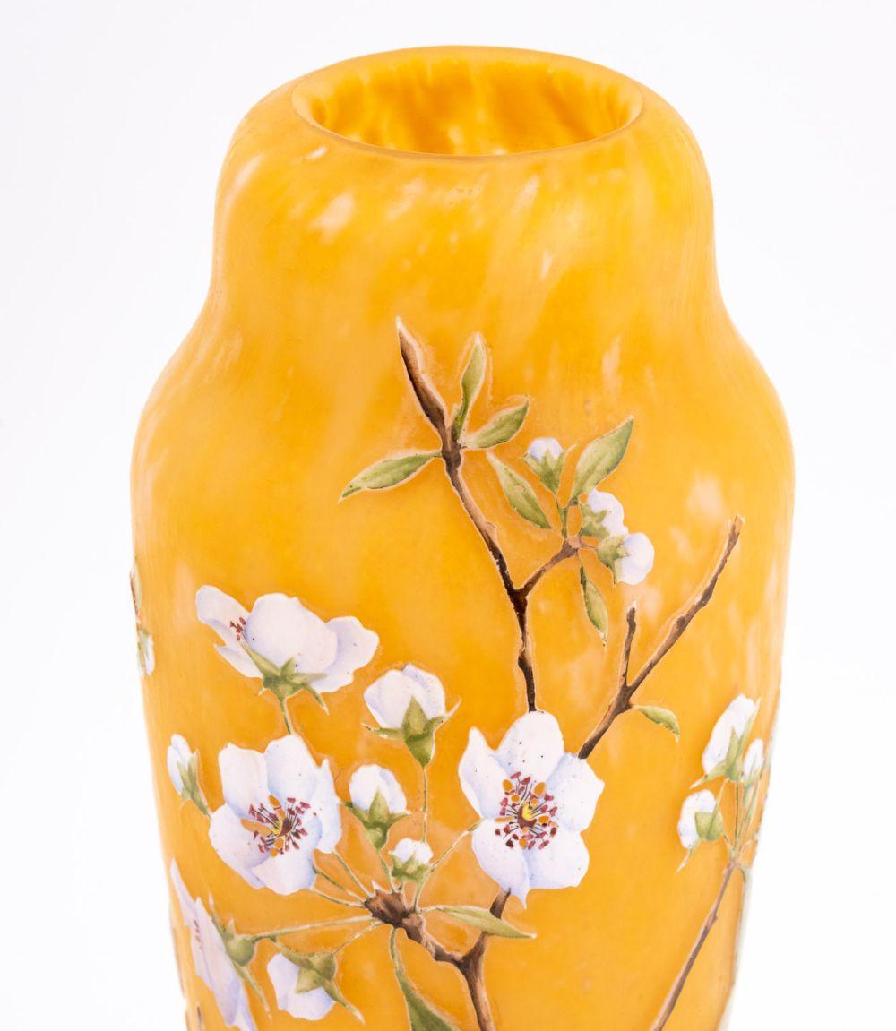 Daum Nancy Cameo Cut and Enameled Art Glass Vase, circa 1900, the tapered body with a mottled gradient of apricot and rose red with cut apple blossom floral overlay, the 