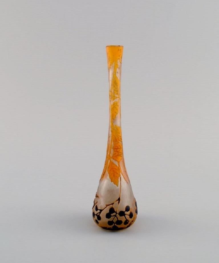 Daum Nancy, France. 
Art Nouveau Prunellier vase in frosted mouth-blown art glass with orange leaves and black berries in relief. 
Approx. 1900.
Measures: 16 x 5 cm.
In excellent condition.
Signed.