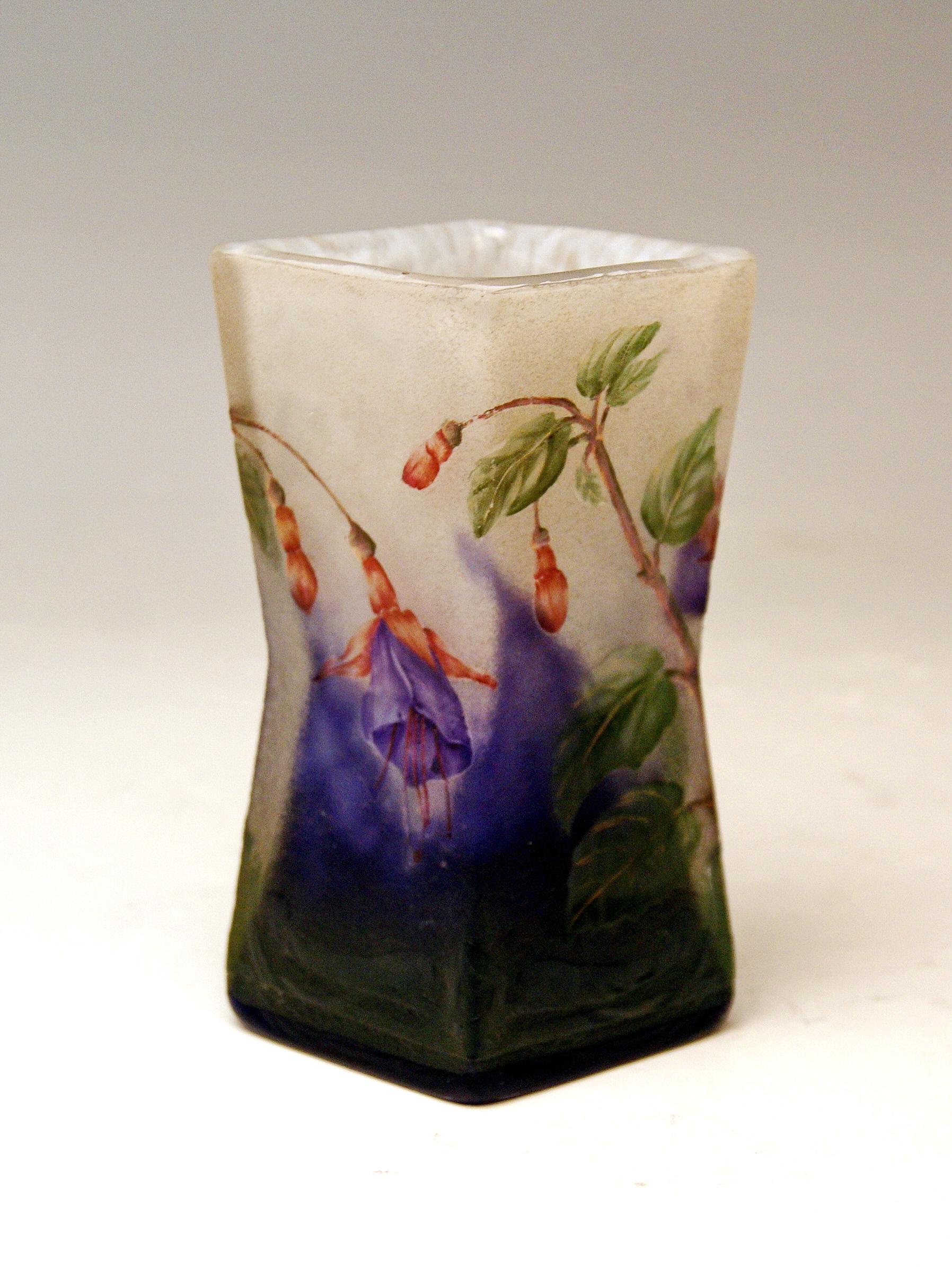Daum Nancy Cameo finest art glass rhomb-shaped vase of Art Nouveau period.
Excellently decorated with interesting flowers: These are fuchsias.

Manufactory:
Daum Frères / made in France / Nancy, Lorraine, circa 1900-1905. 

Designer: Daum