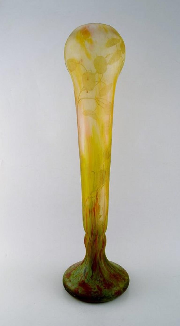 Daum Nancy, France. Colossal Art Deco floor vase in frosted mouth-blown art glass carved with motifs in the form of flowers and leaves. 
1920/30's.
Measures: 58 x 17 cm.
Stamped.
In very good condition.