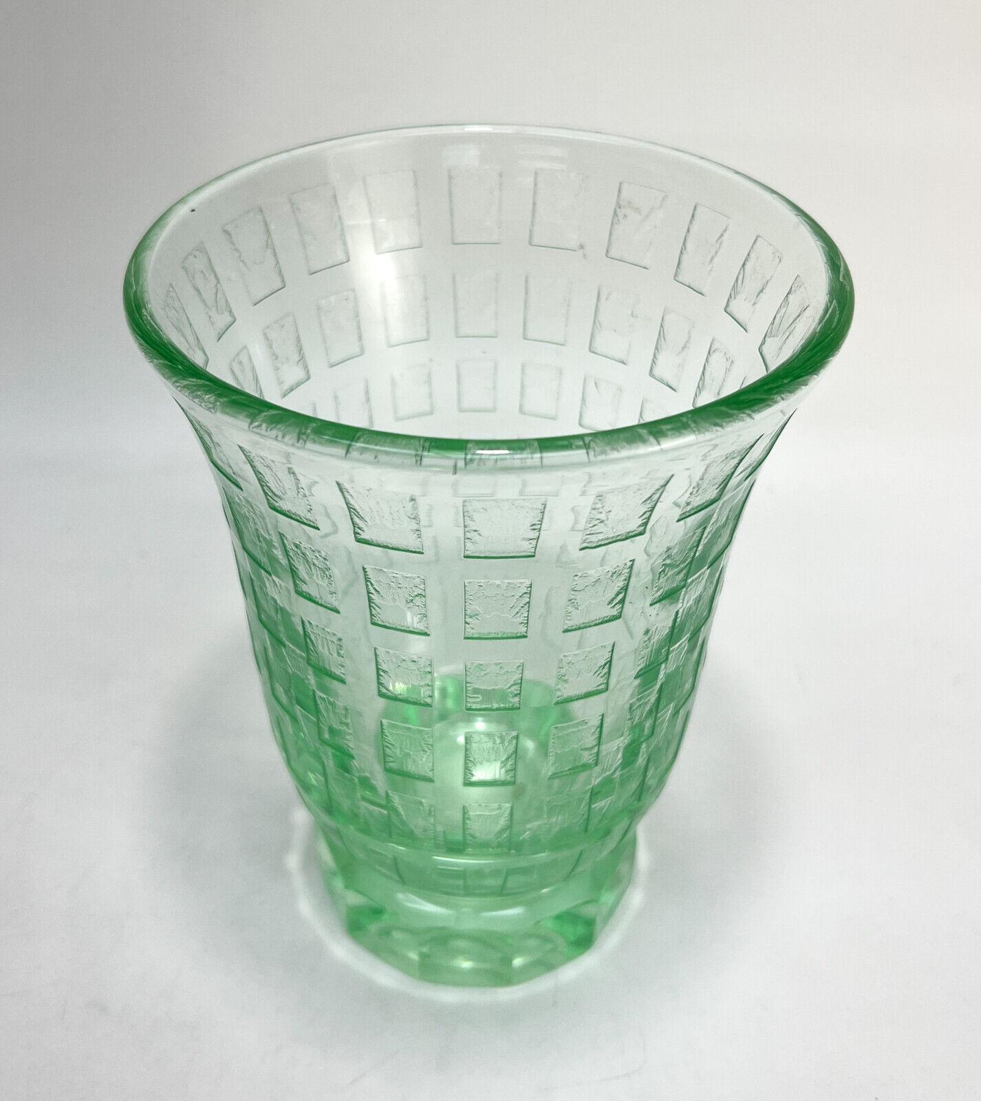 Daum Nancy France green acid etched art glass footed vase, Signed

Daum Nancy France Art Deco acid etched and engraved green vase. Repeating rectangle pattern to exterior. Signed Daum Nancy France along lower edge with polished