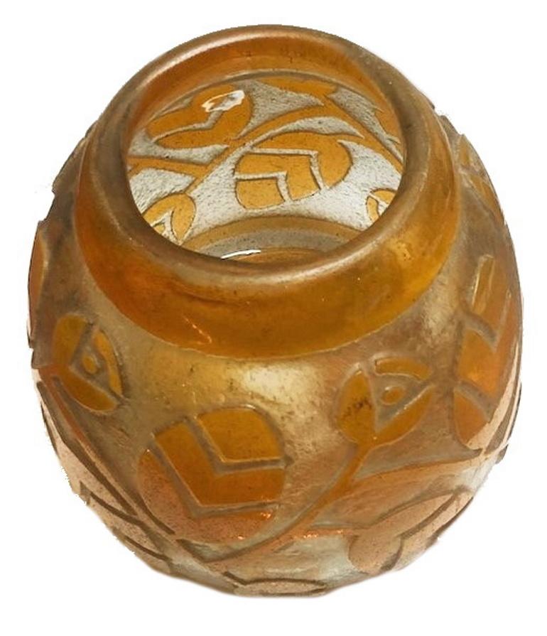 This geometric, floral inspired 1930s French Art Deco deeply acid etched pâte-de-verre elegant flower vase bears the signature Daum Nancy on the base edge. There is a nice weight to the thick-walled heavy glass. It has a beautiful amber yellow color
