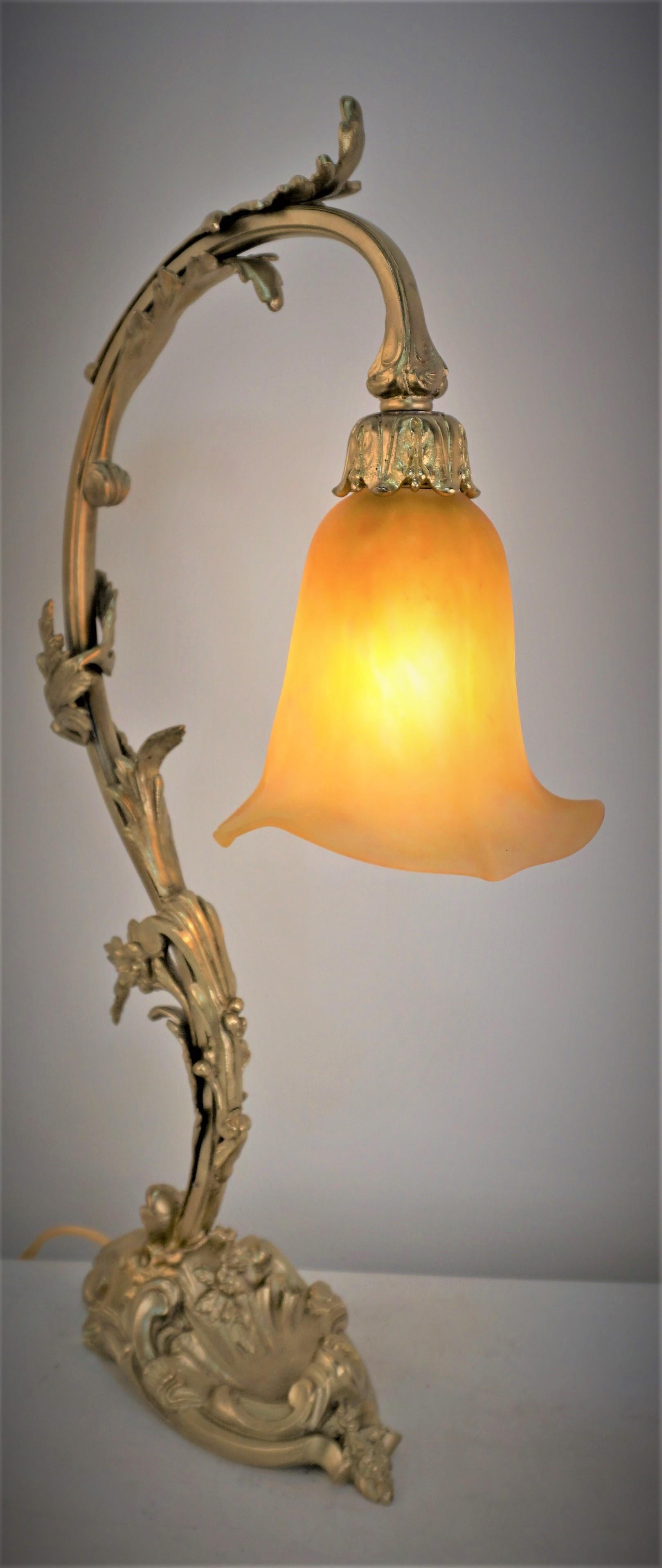 Blown art glass by Daum, fantastic bronze base art nouveau table lamp.
Professionally rewired.