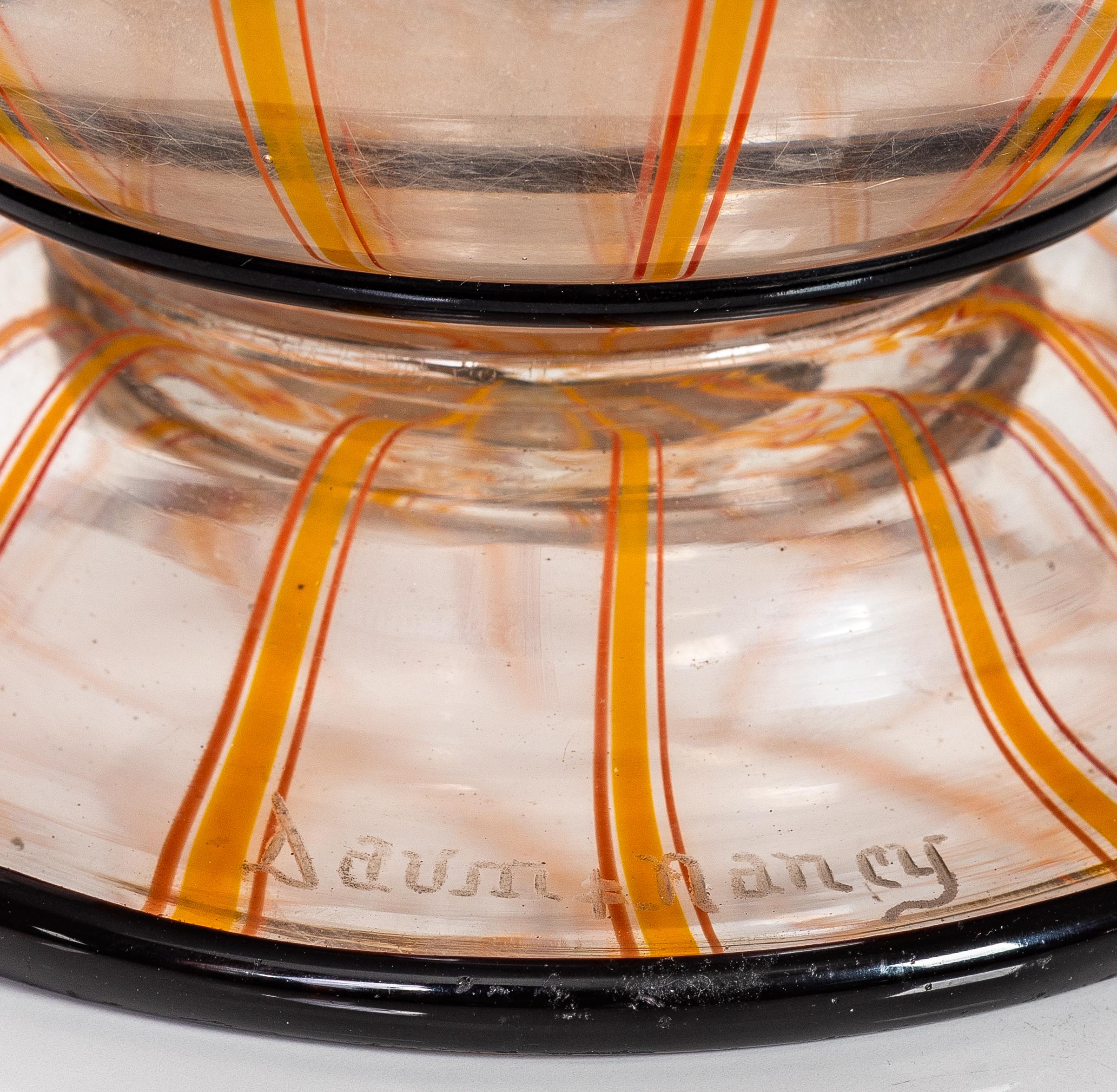 Daum Nancy internally decorated Glass Vase, with applied decoration
France, circa 1925
signed in intaglio Daum Nancy with Lorraine cross
Dimensions
Height 
9.25 in. (23.4 cm.) 
Width
4.75 in. (12 cm.).