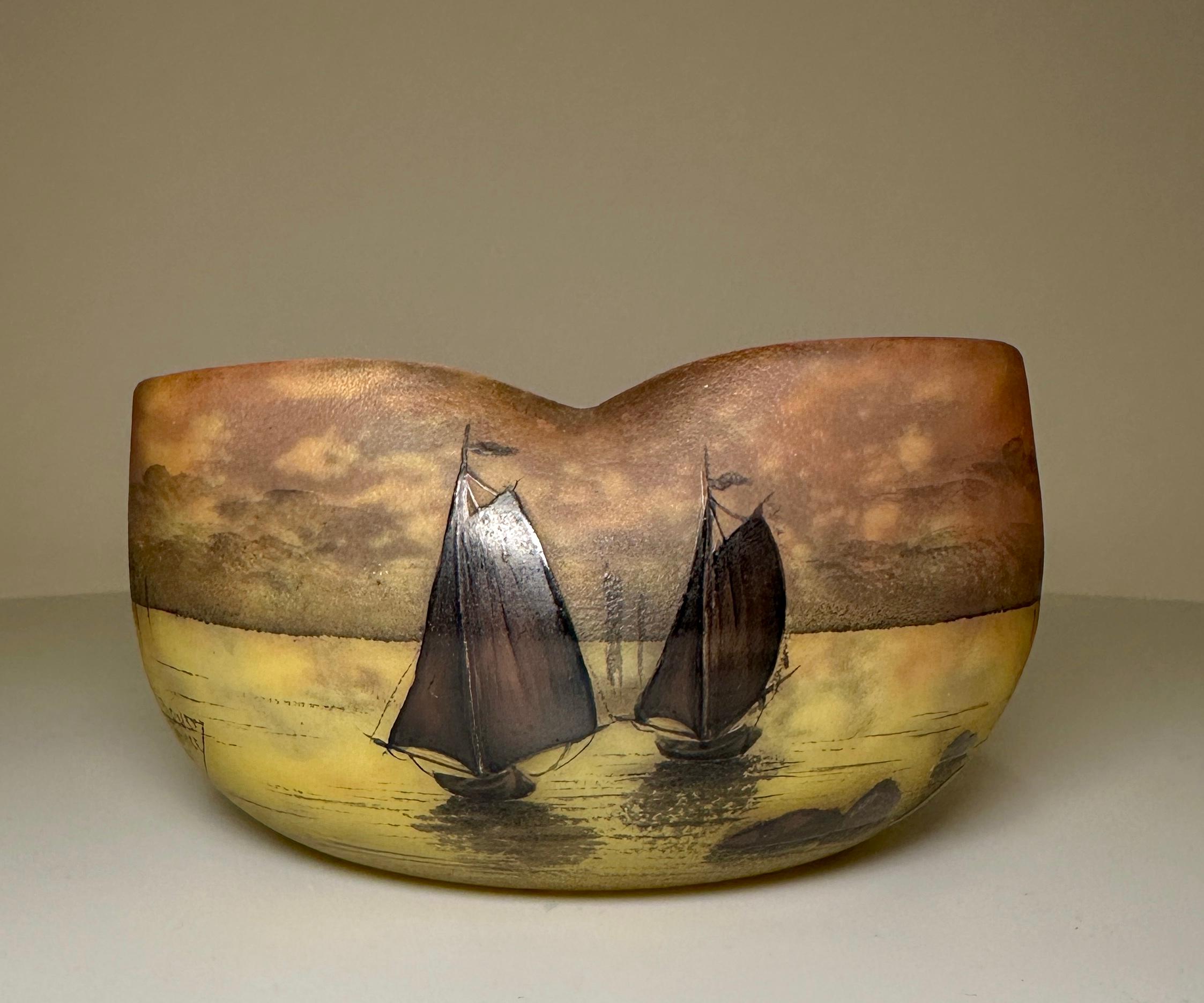 Daum Nancy lobed bowl, circa 1900.

Enameled with sailboats.
