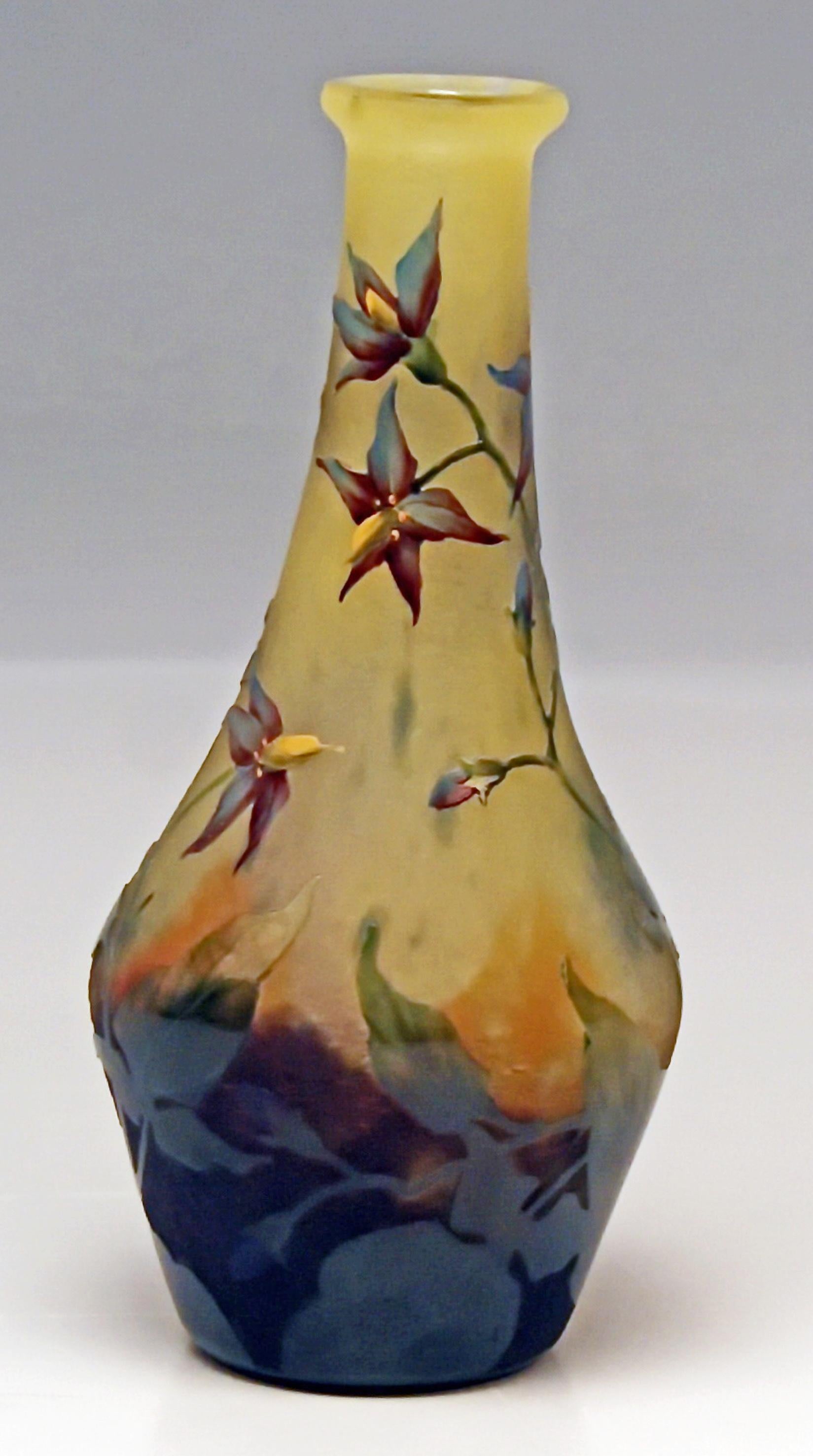 Daum Nancy Cameo finest art glass shoulder stalky vase of Art Nouveau period.
Excellently decorated with lovely flowers: so-said Bittersweet nightshades / blue bindweeds

Manufactory: Daum Frères / made in France / Nancy, Lorraine, circa 1910.