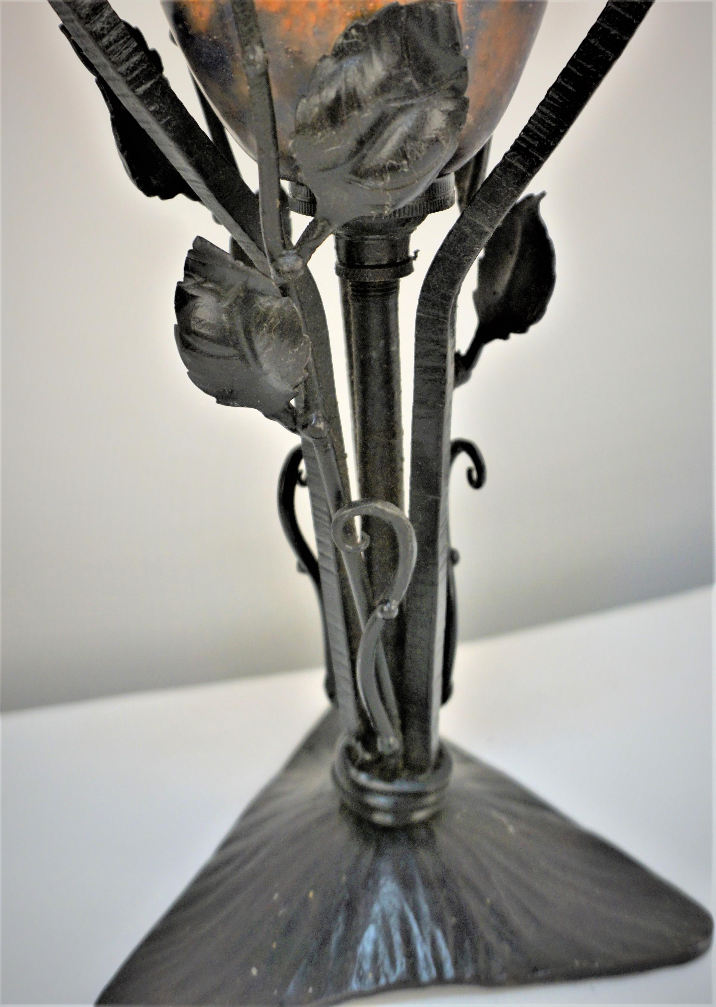 Beautiful blown glass with handmade iron base 1920's art deco table lamp by Daum Nancy.