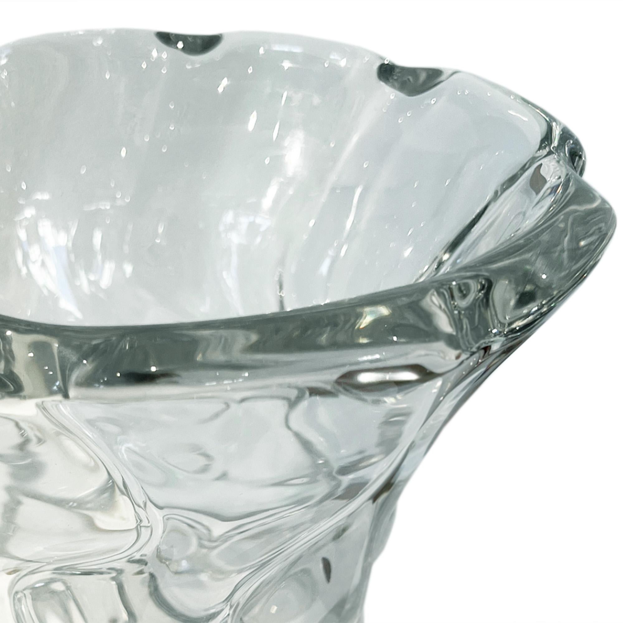 This large champagne bucket has been crafted with a beautiful swirl design.

Made by the Parisan maker Daum in the 1960s, it can also be a decorative piece, or a flower vase too. Superb quality thick glass and very heavy!

Stamped at the base.