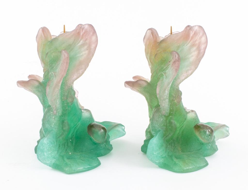 Pair of Daum pate de verre green and purple art glass candlestick holders of foliate form with leaves, fruit, and snails, surmounted by gold-tone metal prickets, each marked 