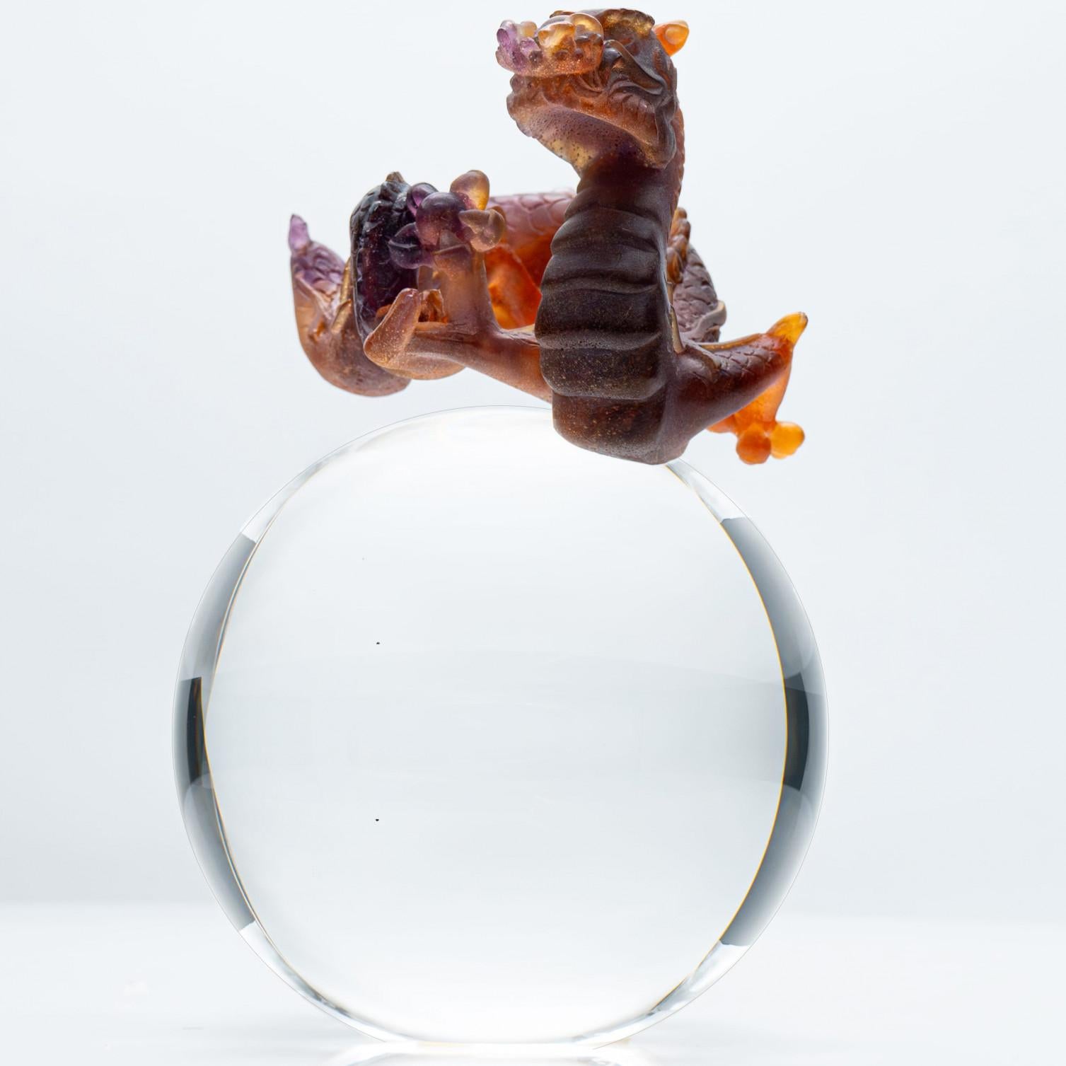 Luxury at its finest, made by the World renowned French maker of ‘Daum’ of Nancy, France circa 1960-80. This item crystallizes the extraordinary know-how of the Daum craftsmen.

Daum France brown colored dragon on crystal sphere  with variations of