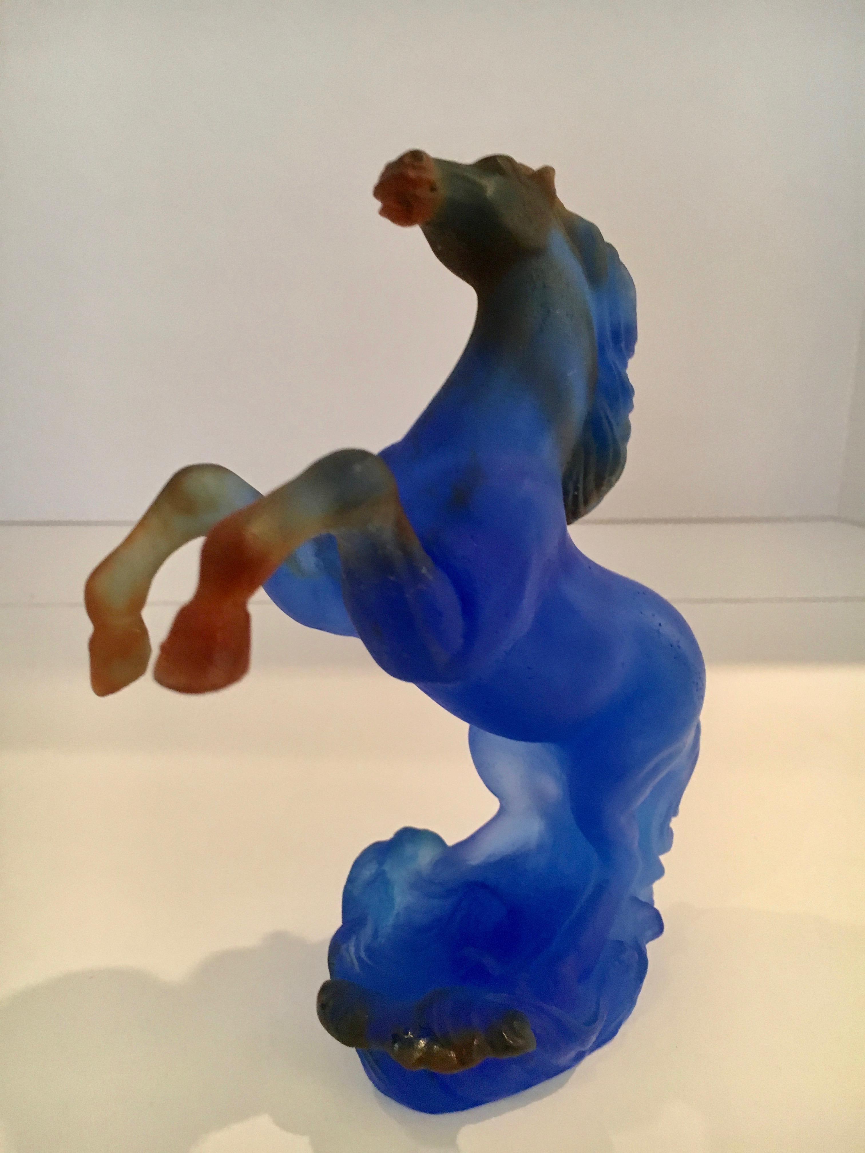 Blue Daum rearing horse sculpture.