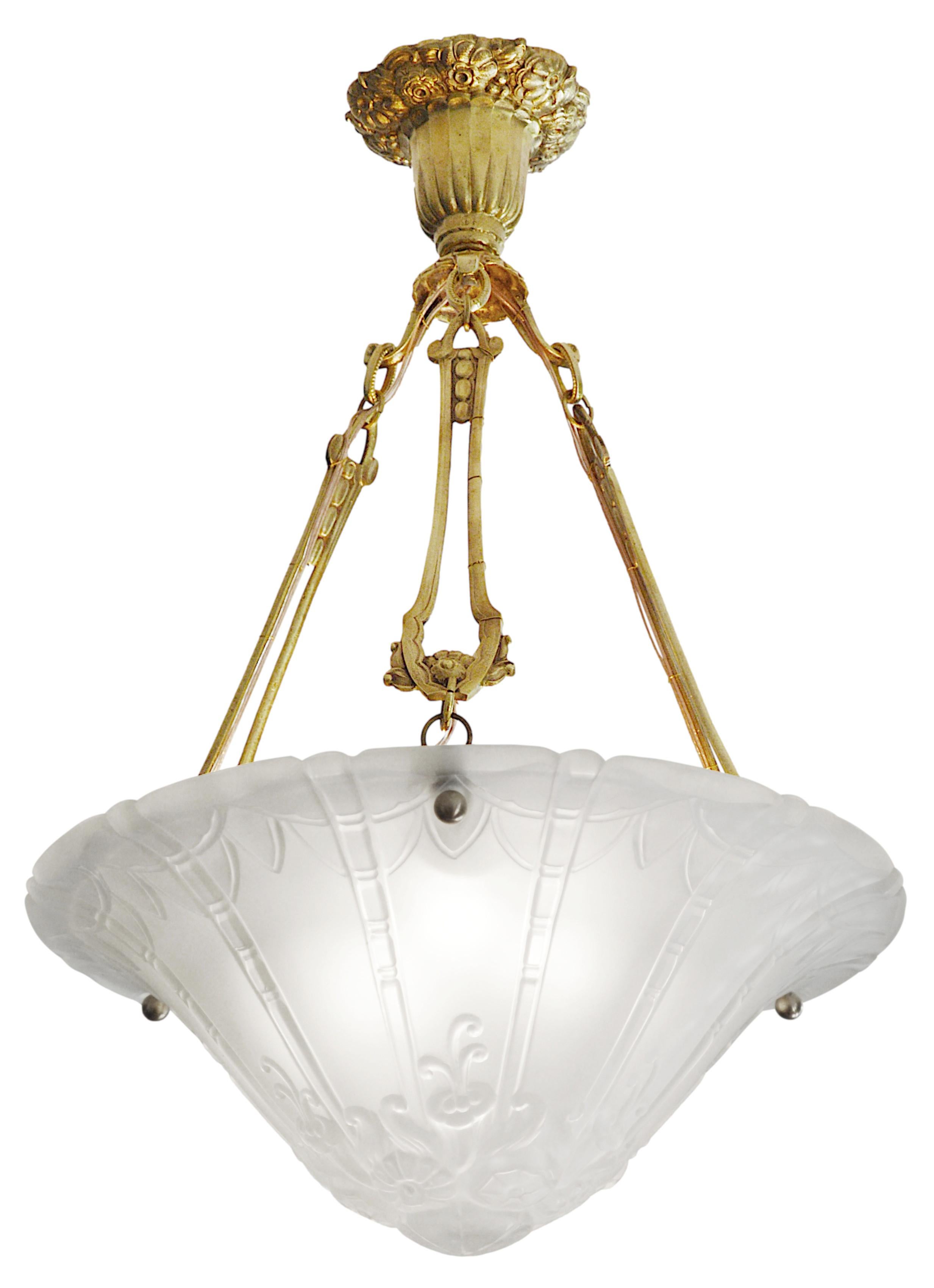 French Art Deco pendant chandelier by Pierre D'AVESN at DAUM'S (Croismare, Nancy), France, early 1930s. Thick molded-pressed satiny glass shade hung at is chiseled solid bronze. Height: 23.2