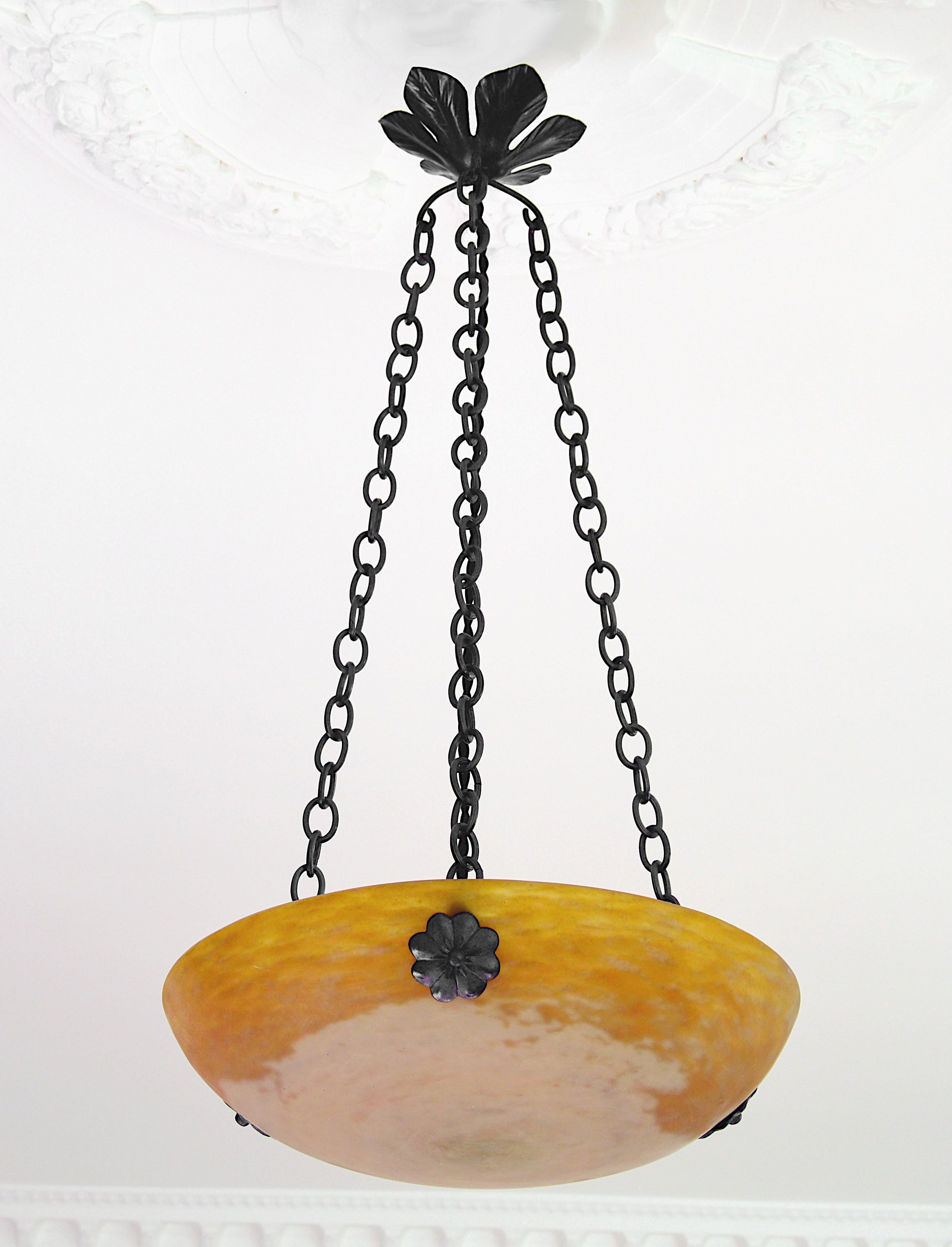 French pendant chandelier by Daum (Nancy), France, 1900-1905. Blown double glass shade hung at its original wrought iron frame. Colors: ochre, white sand and pink. Height 26.2
