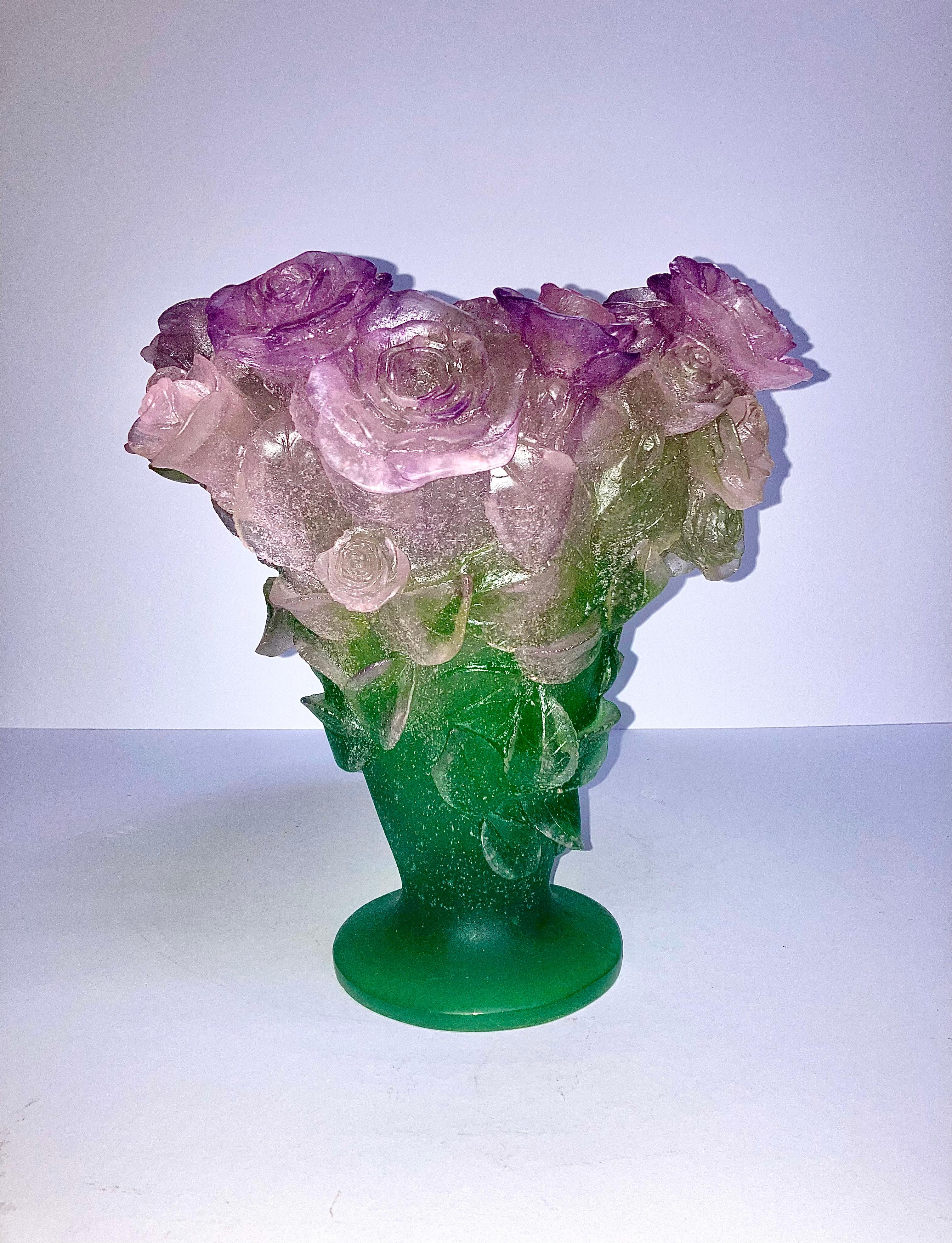 This is an flaring form, molded with roses in pink shading to green, signed. Height 12 inches. Excellent condition


