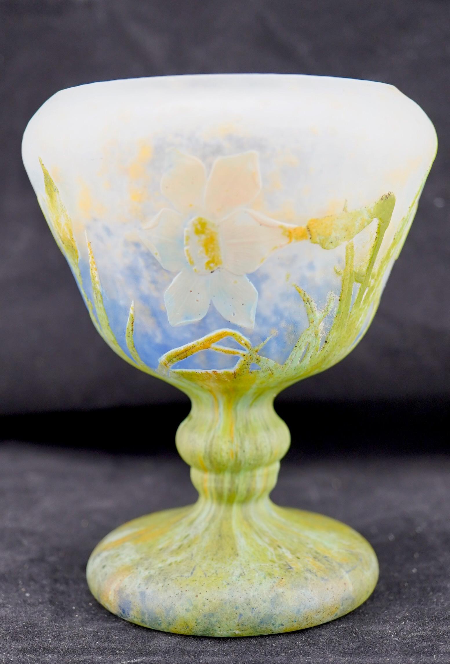 Very fine wheel carved and padded daffodil (jonquilles) footed vase by Daum. Very fine example of Daum Art Nouveau Work. Siged on the bottom with Daum Nancy mark and Croix de Lorraine.
