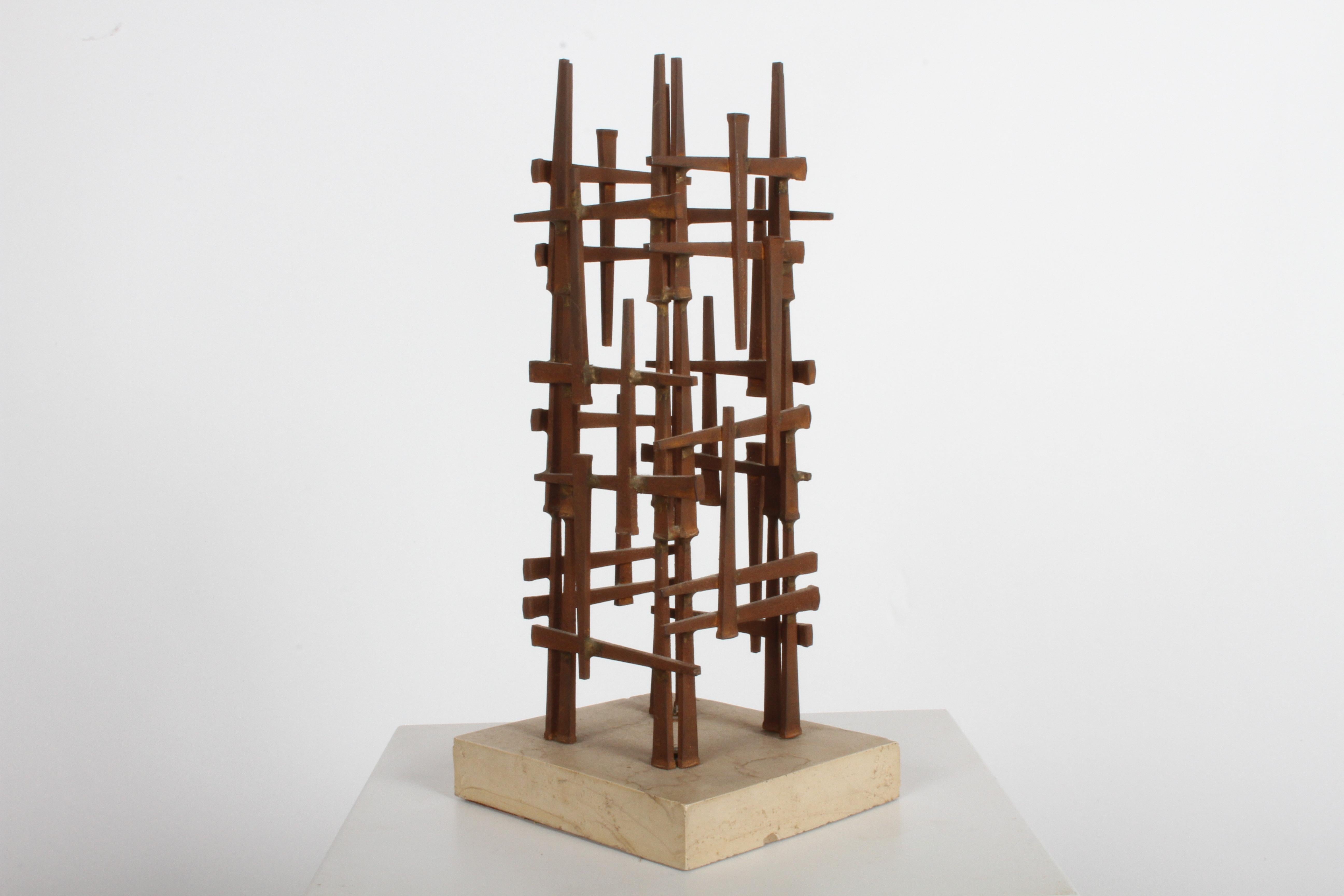 St. Louis designer / artist Dave Grossman designs, made these sculptures in the late 1960s and early 1970s in the Brutalist style, using welded square nails on cast base. Great coffee table or book shelf sculpture. In the style of Marc Weinstein,