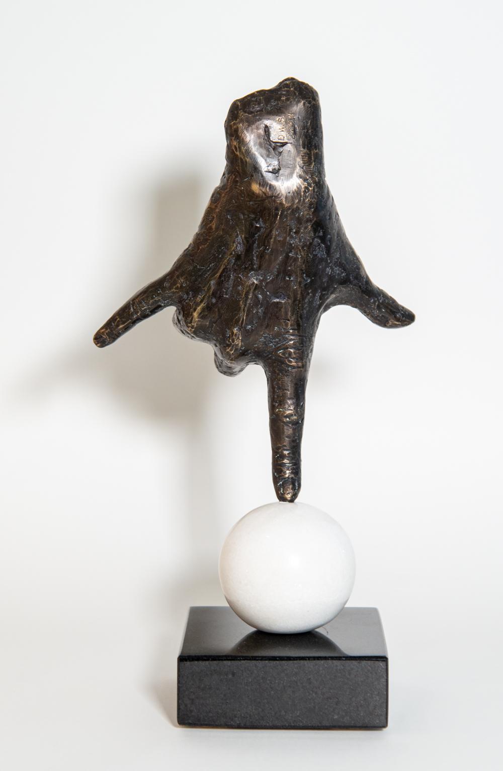 A bronze hand, modelled after the artist’s own, balances on its index finger atop a sphere in this imaginative pop art sculpture by Dave Sheridan. Called ‘Balance’ this piece was inspired by recent world events and our collective challenge to find