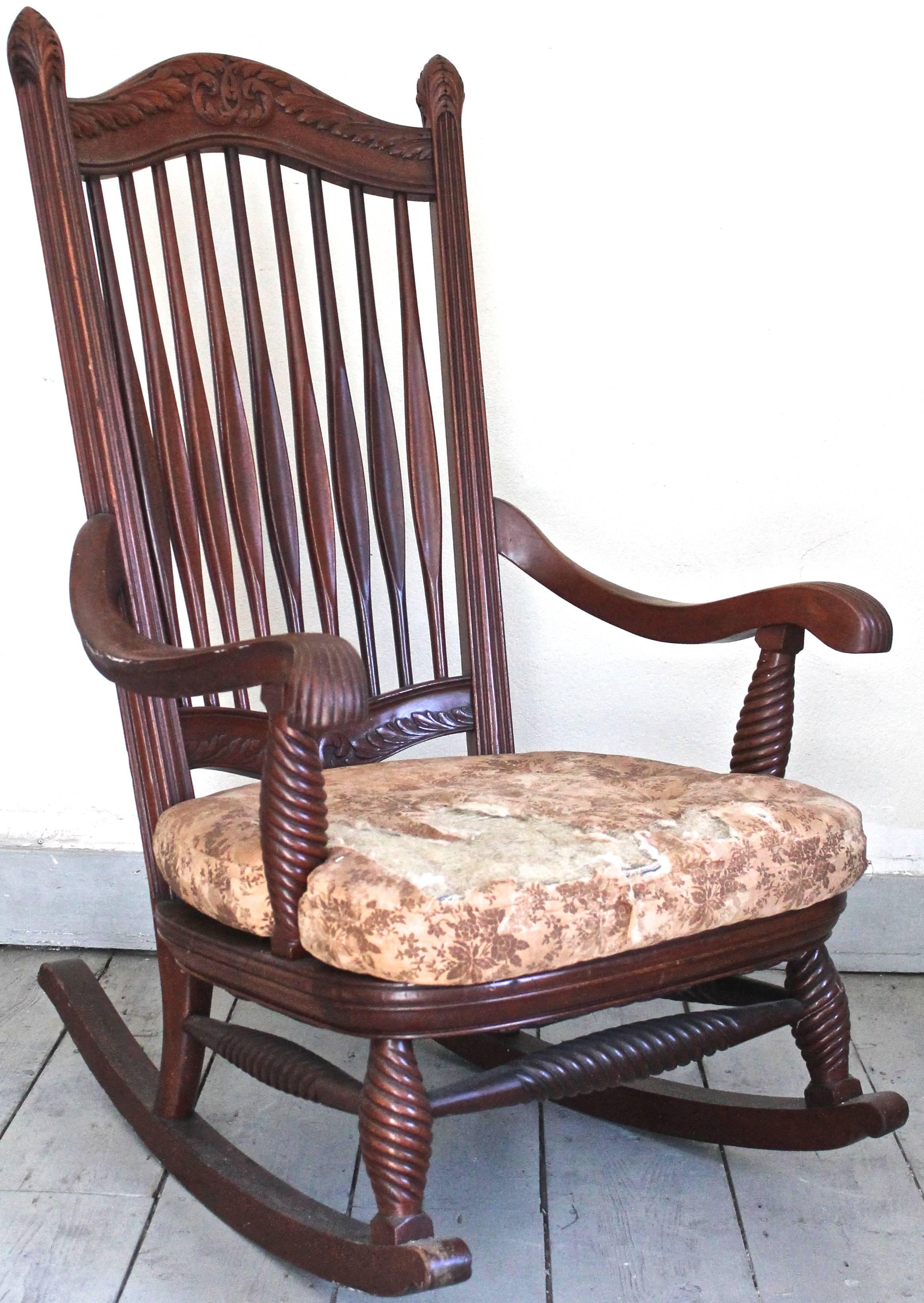 A large beautifully carved rocking chair, the design attributed to Francis Bacon.