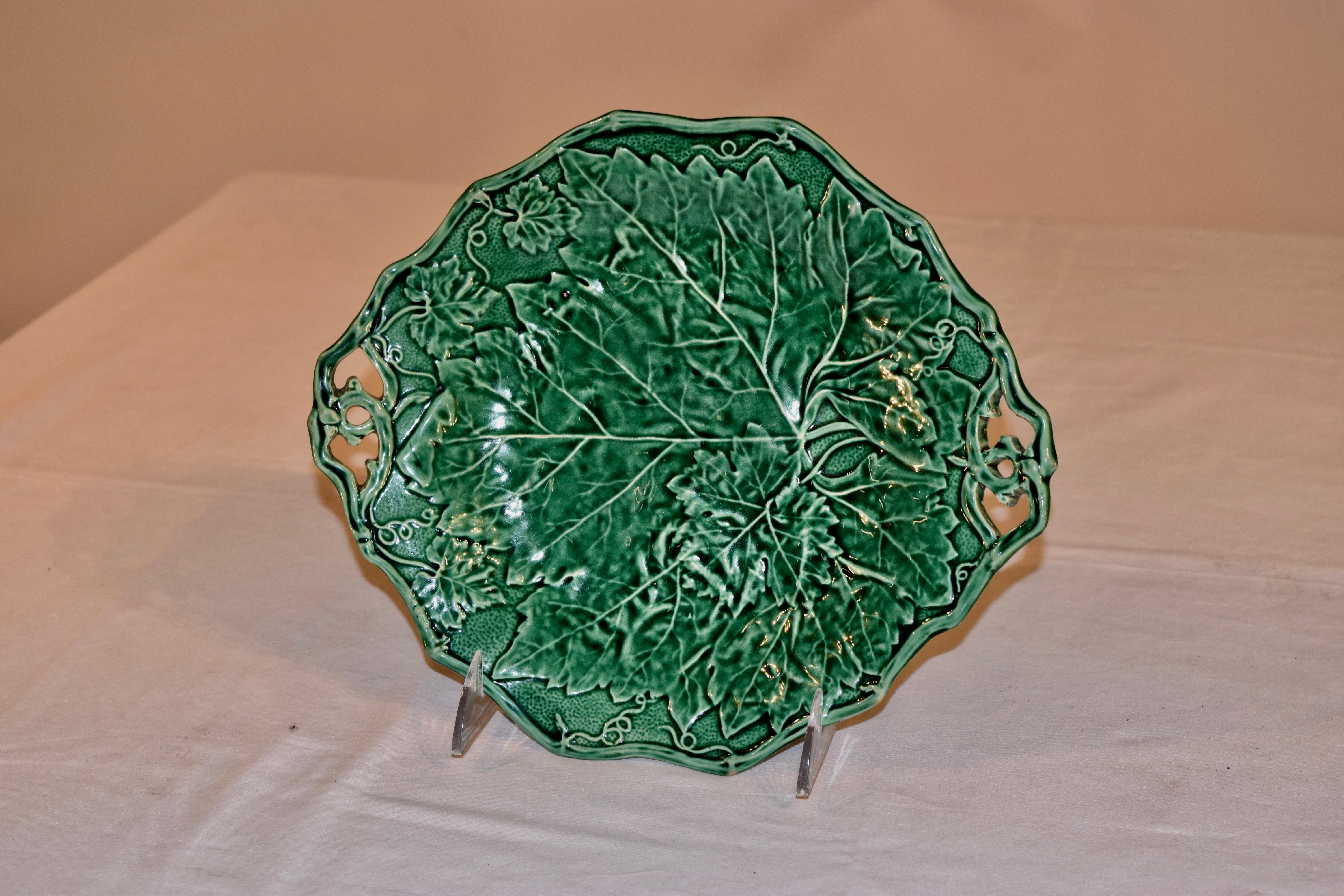Davenport double handled Majolica dish with Davenport impressed mark and the year for 1852 stamped on the back. Gorgeous pattern with leaves and vines.