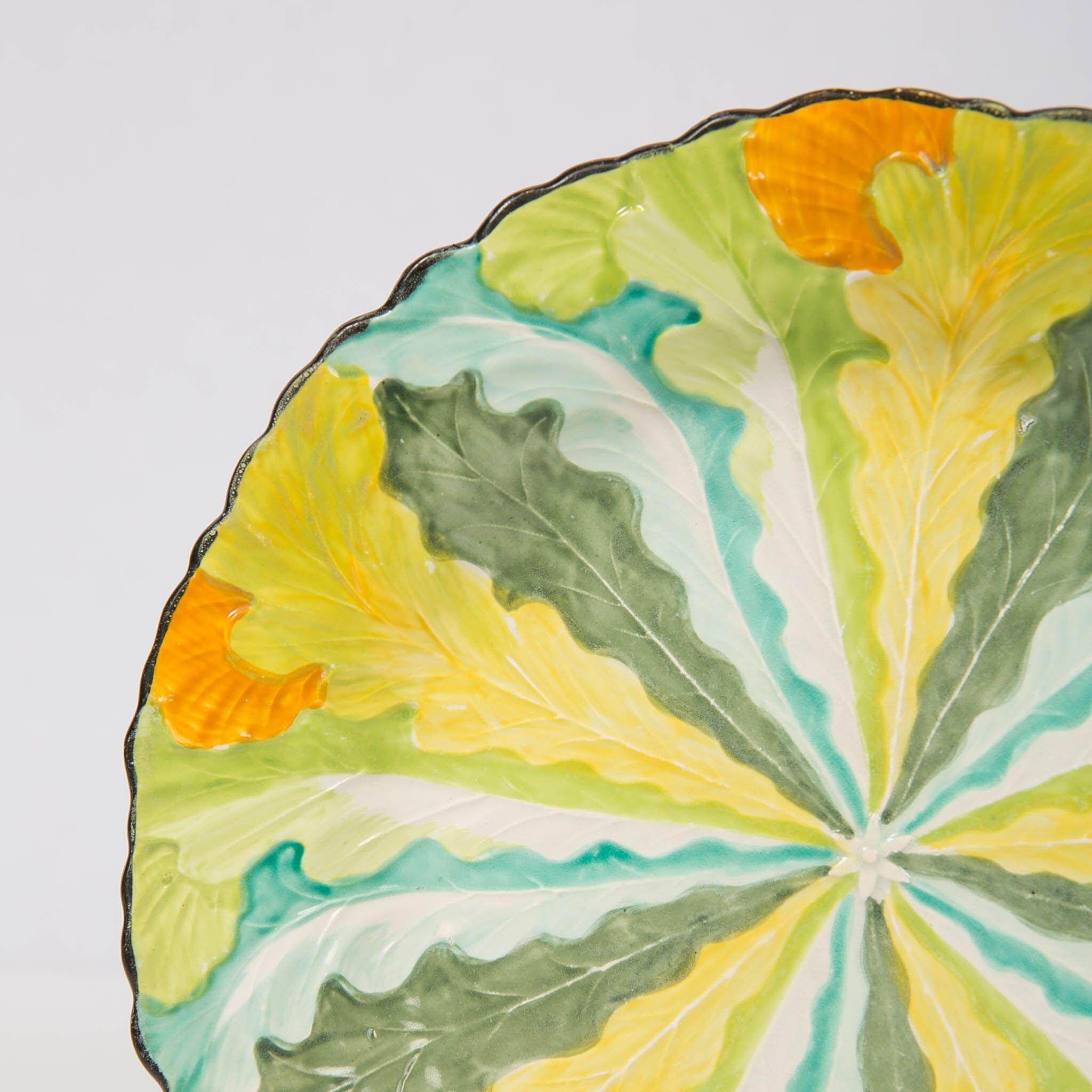 Why We Love It: The dish is marvelously colored and certainly stunning!
A rare Davenport pearlware oak leaf pattern plate. The leaves are picked out in vibrant colors of yellow, green, orange and turquoise. The combination of colors is beautiful