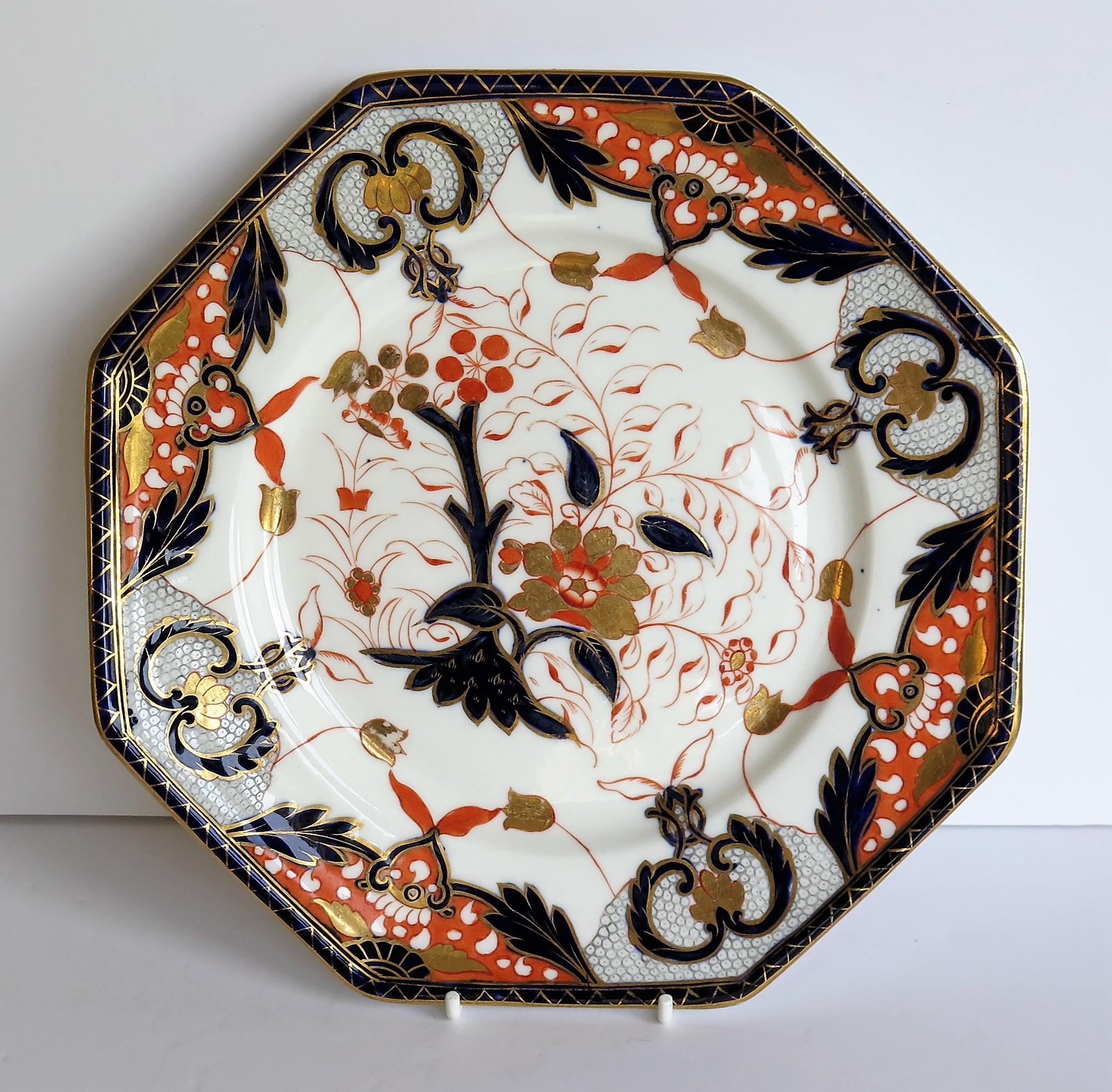 This is a striking porcelain octagonal plate, hand painted and gilded, from the Davenport Company of Longport, Staffordshire Potteries, England, dating to the 19th century, Victorian period, circa 1875.

The Plate has an octagonal form and is