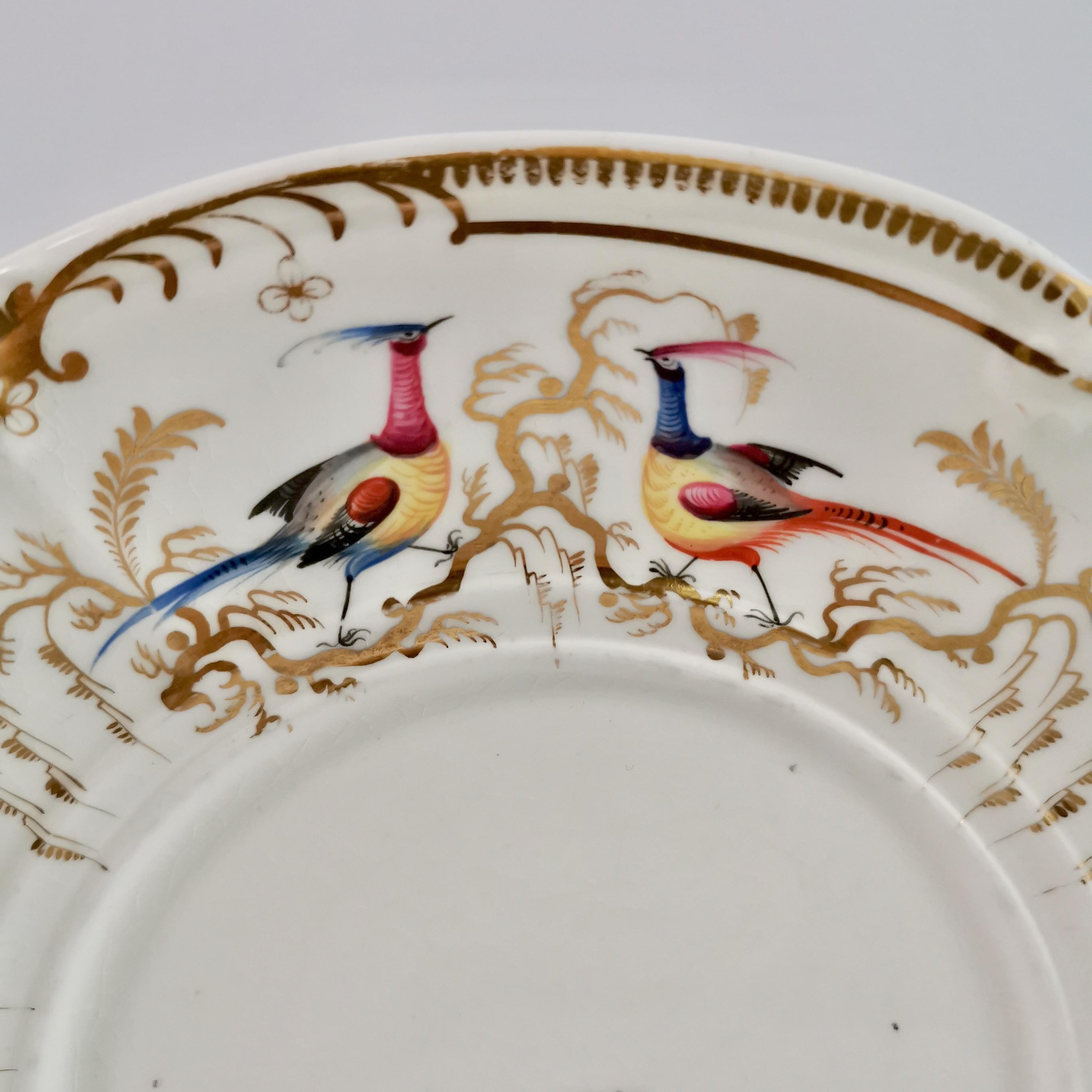 This is a beautiful tureen stand or big plate made by Davenport between 1830 and 1837. The stand has a white ground and beautifully hand painted birds in the Sèvres style.

We have a very similar plate in green available, please see separate