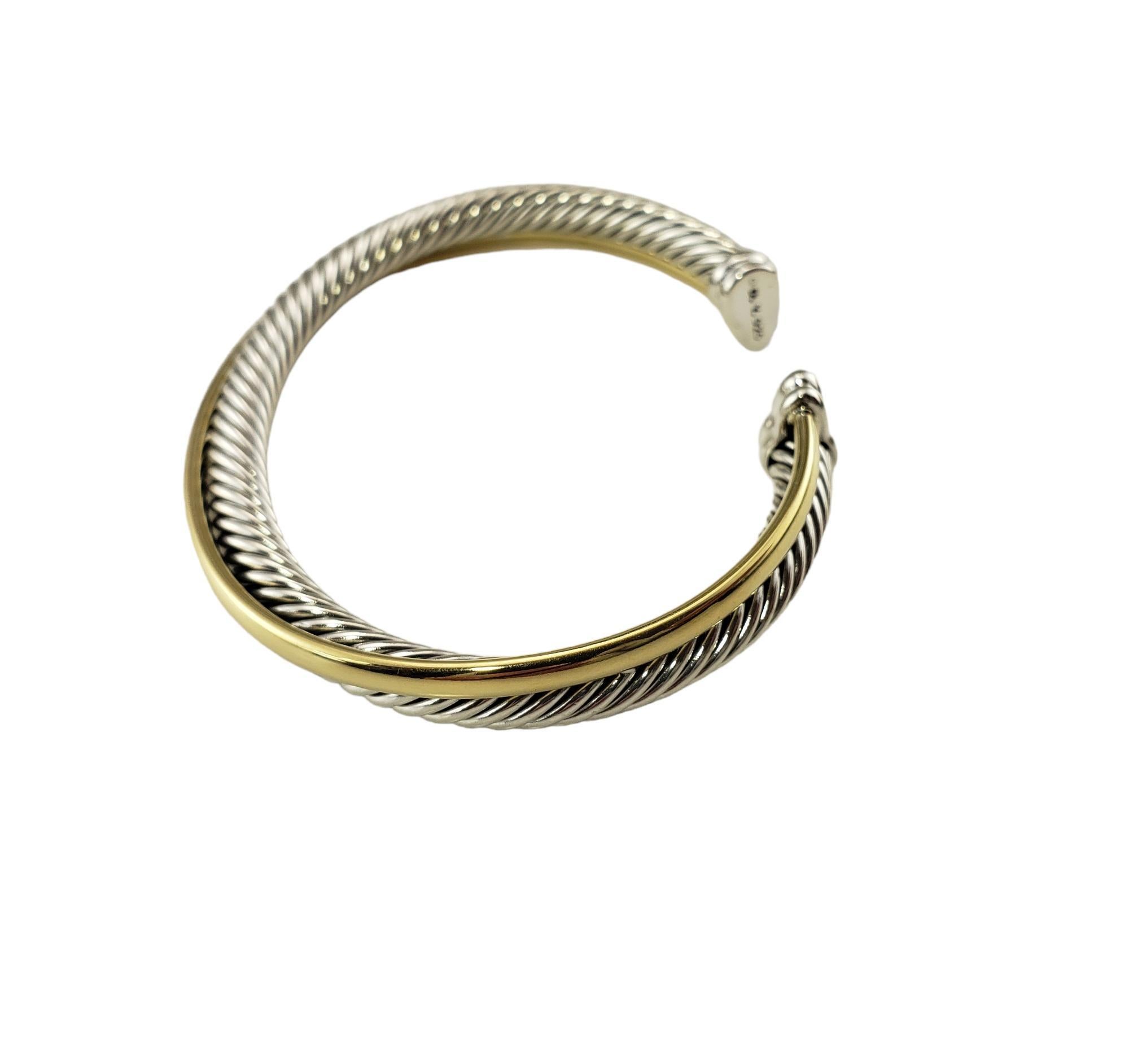David Yurman 18K Yellow Gold Plated and Sterling Silver Cuff Bracelet-

This elegant cuff bracelet by David Yurman is crafted in beautifully detailed sterling silver and 18K yellow gold plated silver 

 Width:  5 mm-7 mm.

Size:  6 inches  (0.5 inch