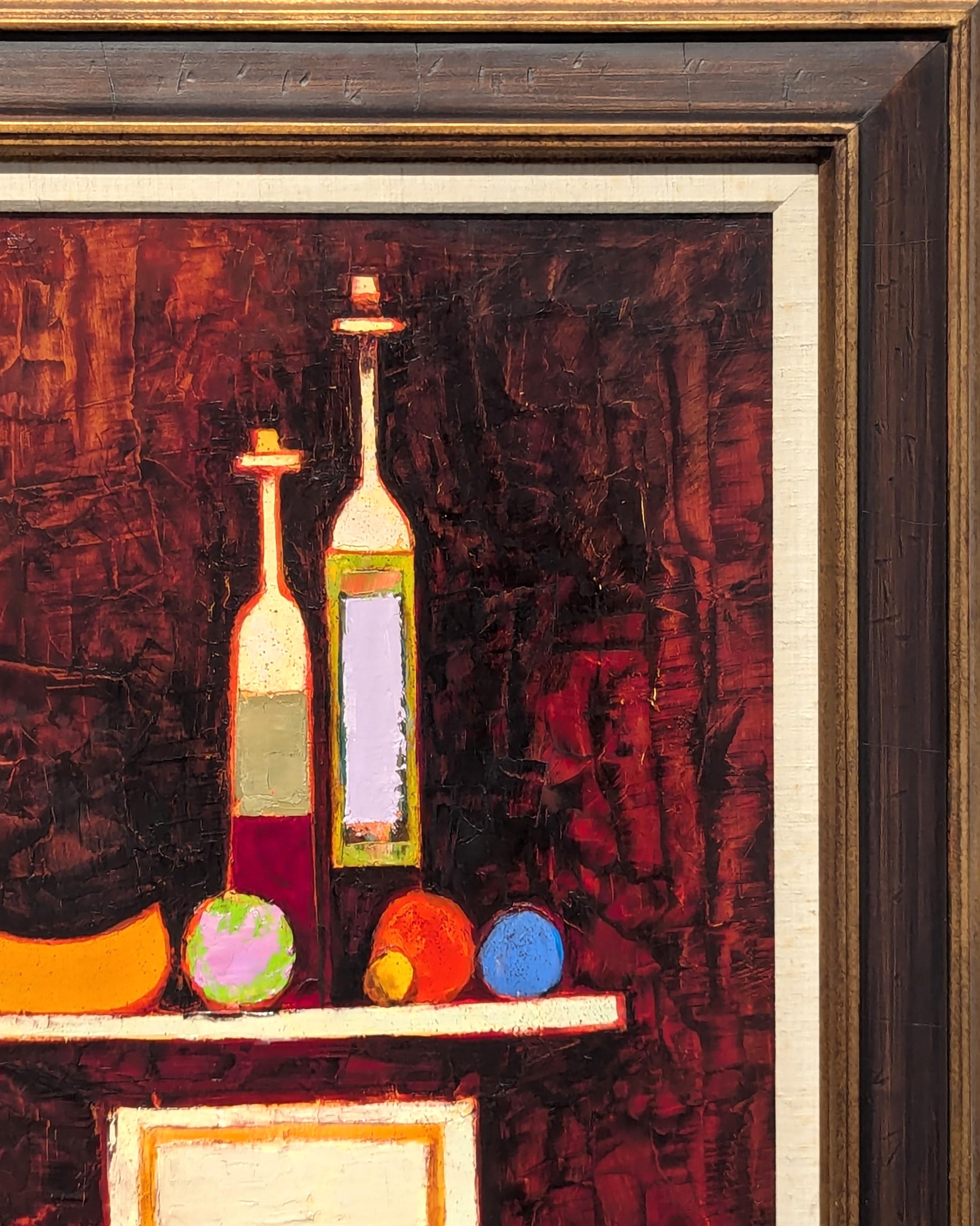 Modern warm toned Cubist style still life painting by Texas artist David Adickes. The work features a collection of bottles and fruit displayed on a pedestal against a deep maroon background. Signed in the front lower right corner. Currently hung in